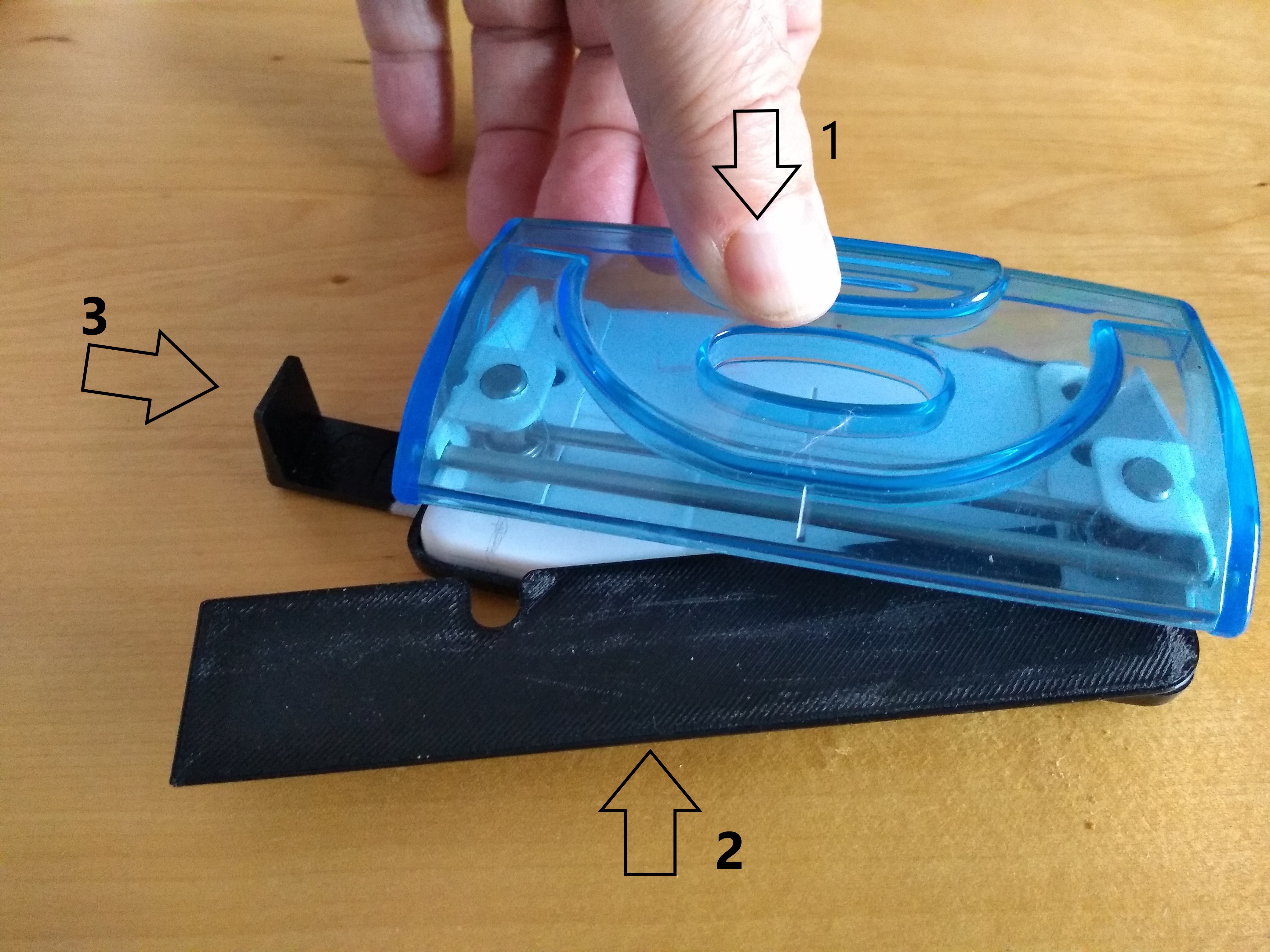 Tool that sets a 2 hole punch to make 4 holes.