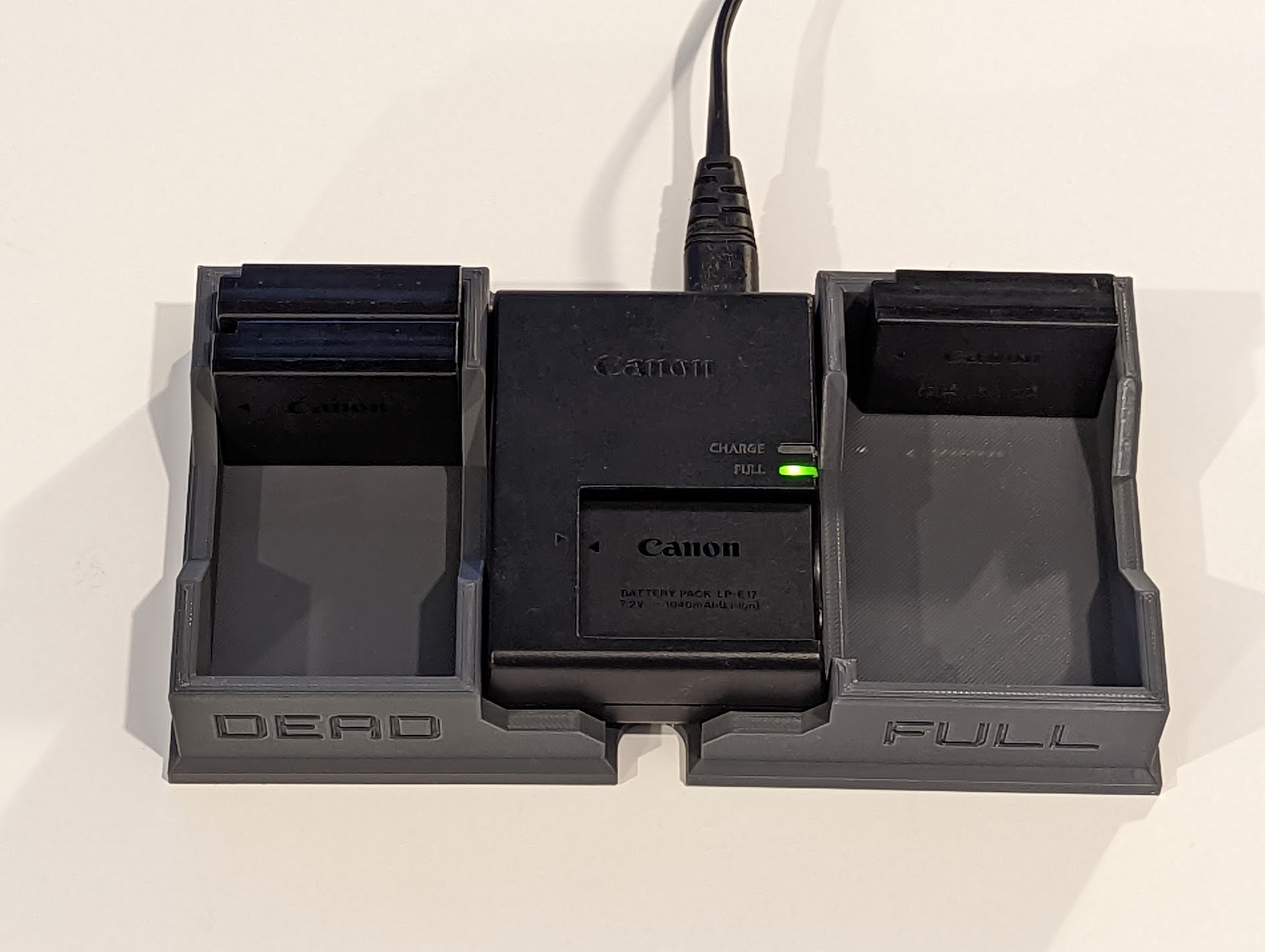 Canon camera battery (LPE17) charger base by Tommo Byrne Download