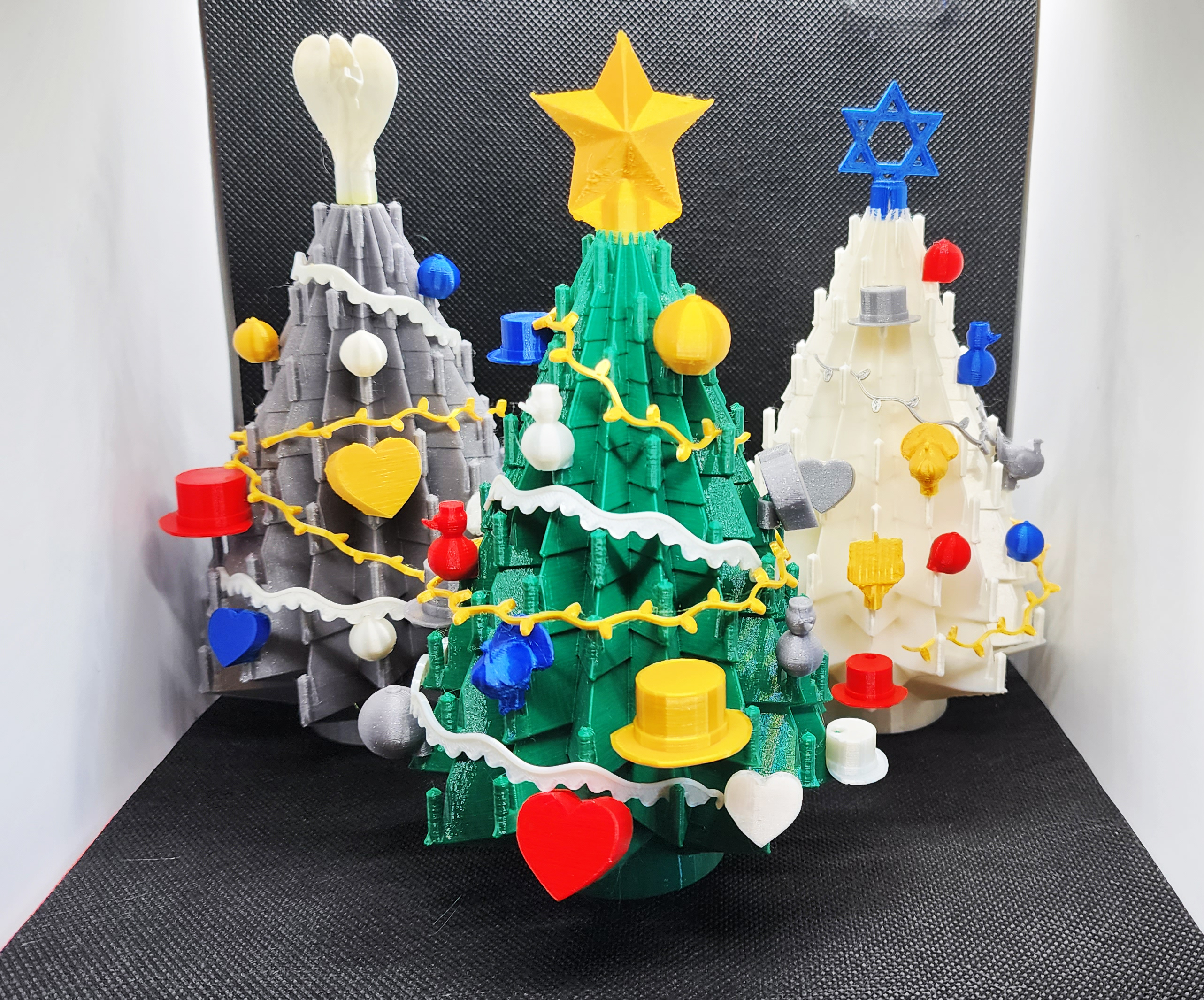 Holiday tree display with ornaments & toppers