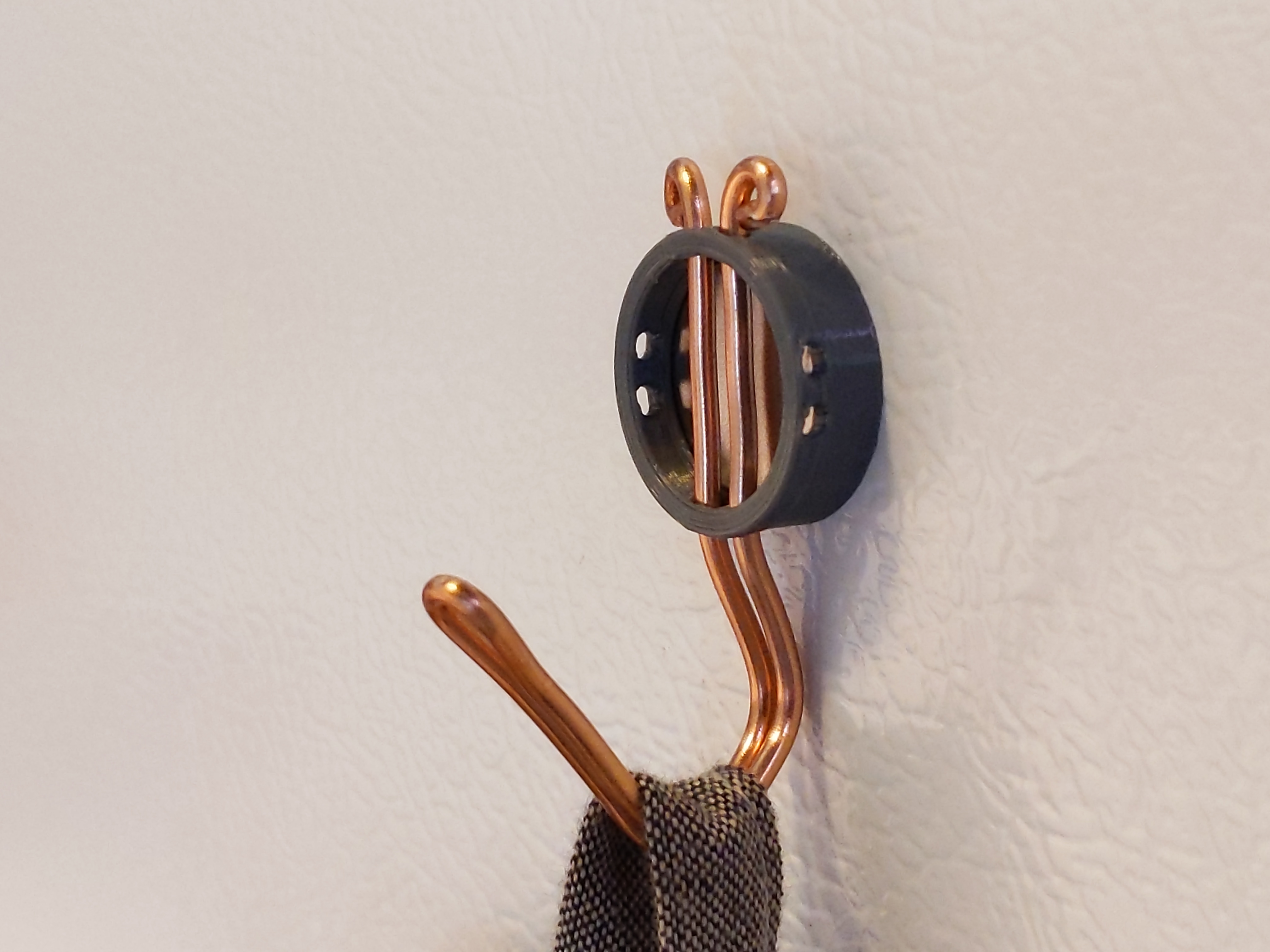 Frame for bent-wire magnetic hook or eye