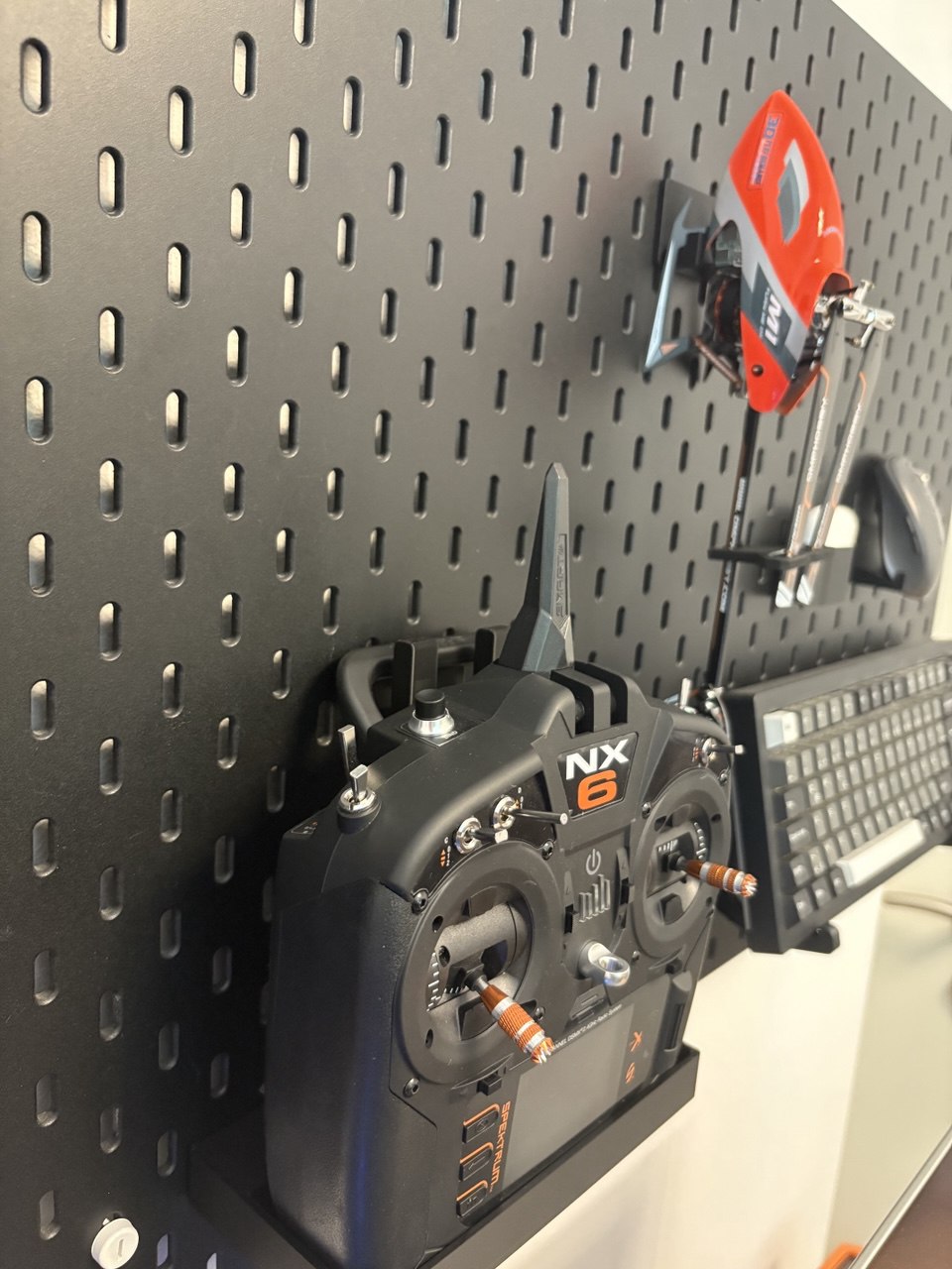 Wall mount for Spektrum NX6, designed to fit IKEA Skådis pegboards.
