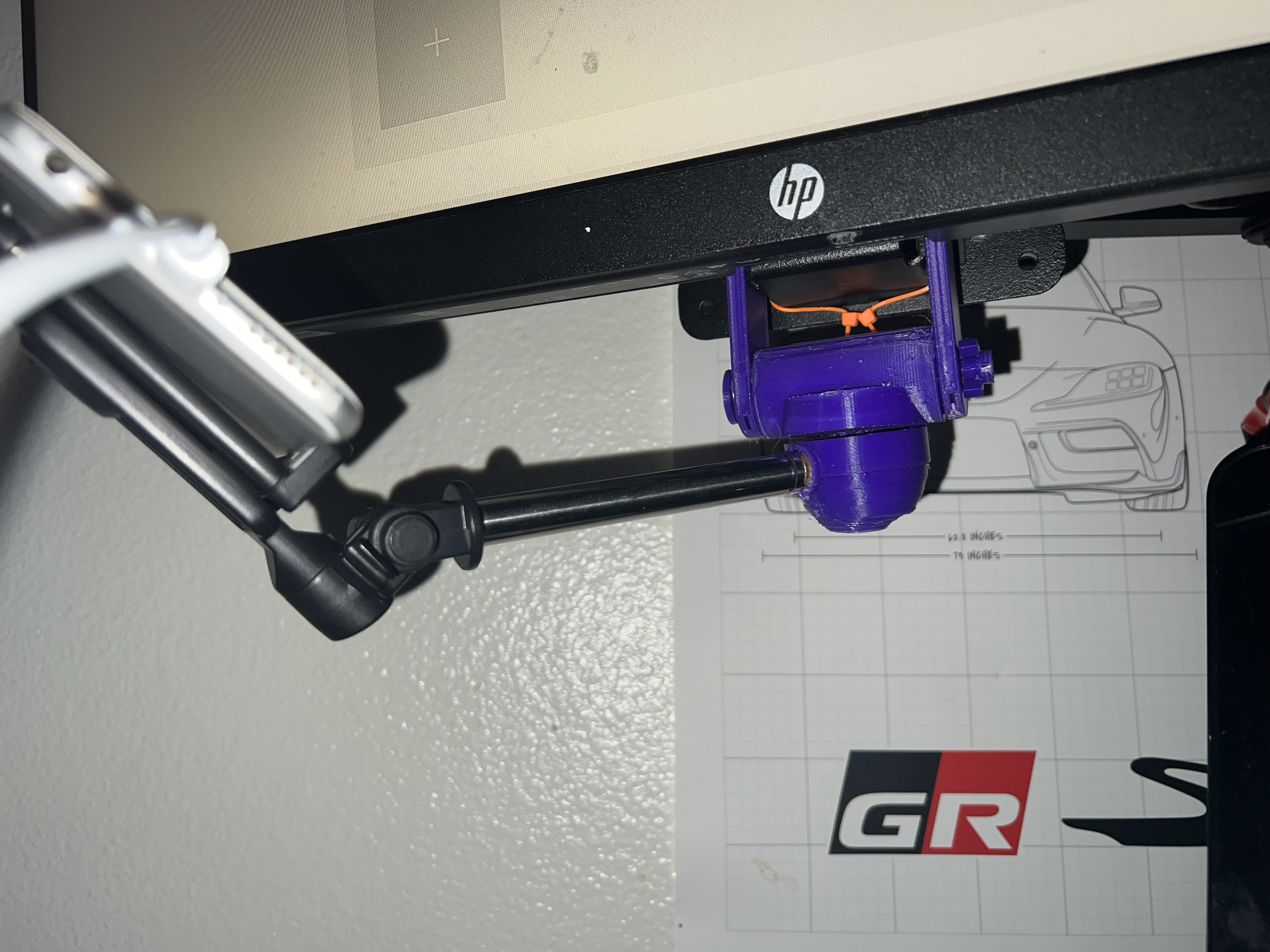 Obscure under-monitor rotating mount (intended as phone mount)