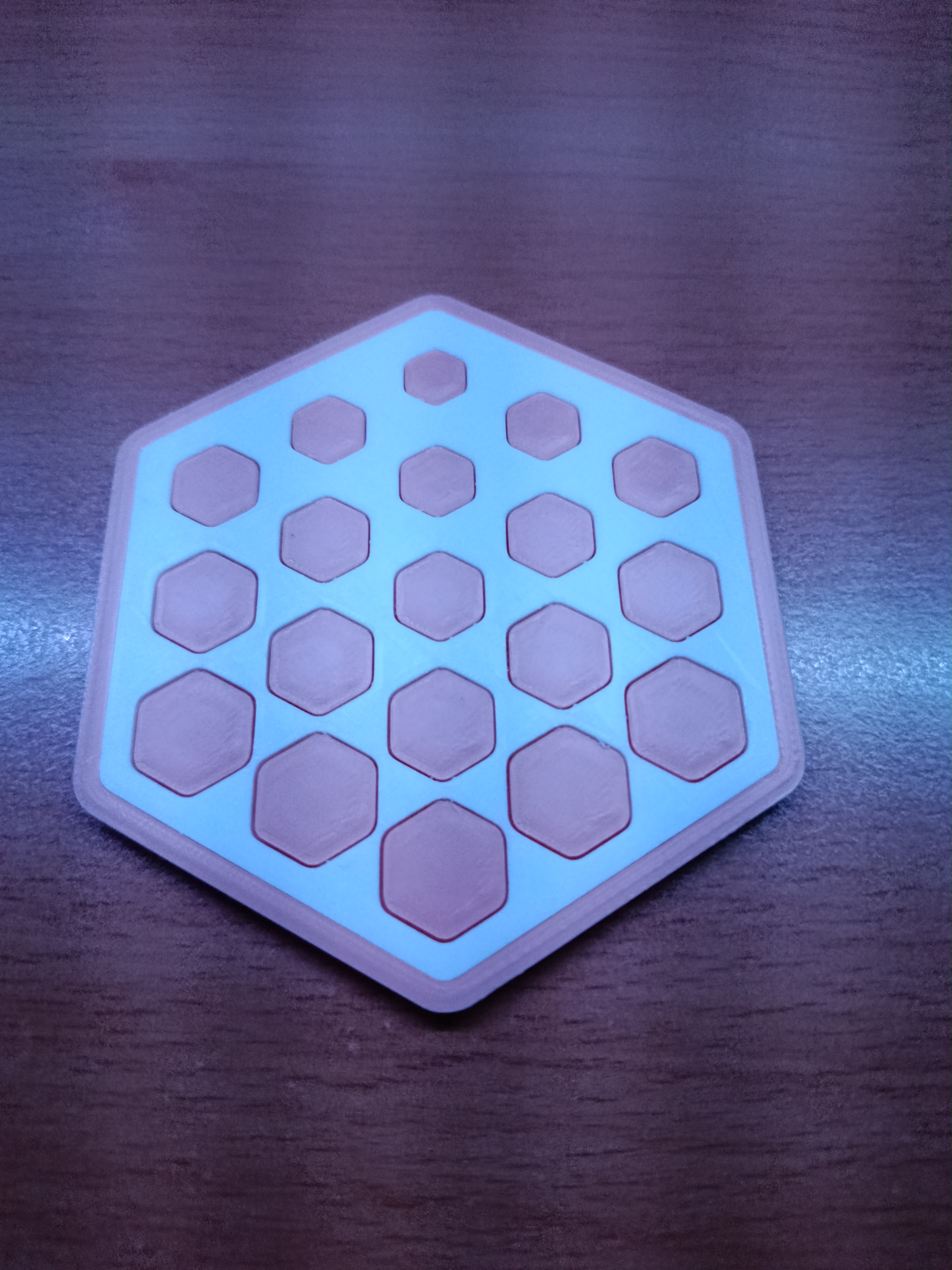 Hexagonal coaster with hexagonal pattern