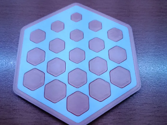 Hexagonal coaster with hexagonal pattern