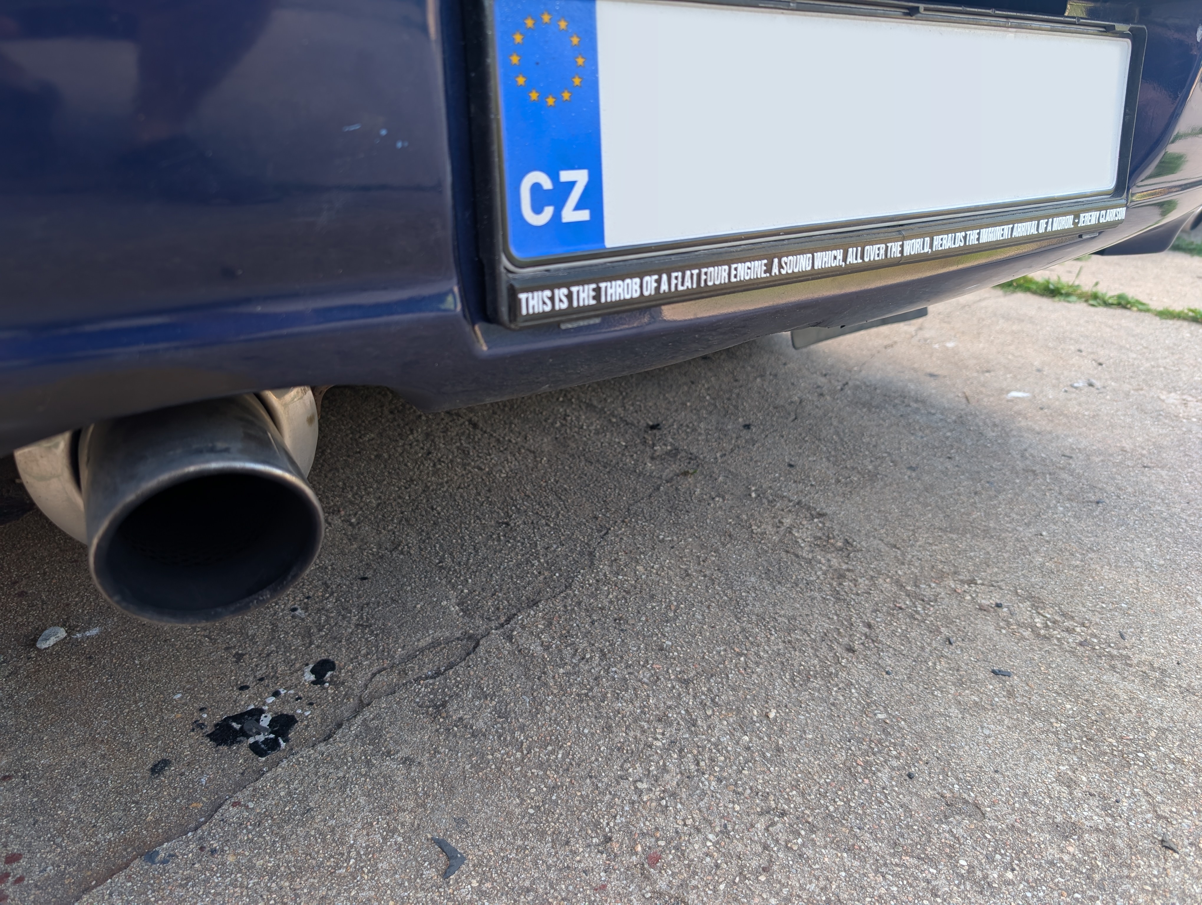 Plaque under license plate, featuring  paraphrase of Jeremy Clarkson’s quote about Subaru