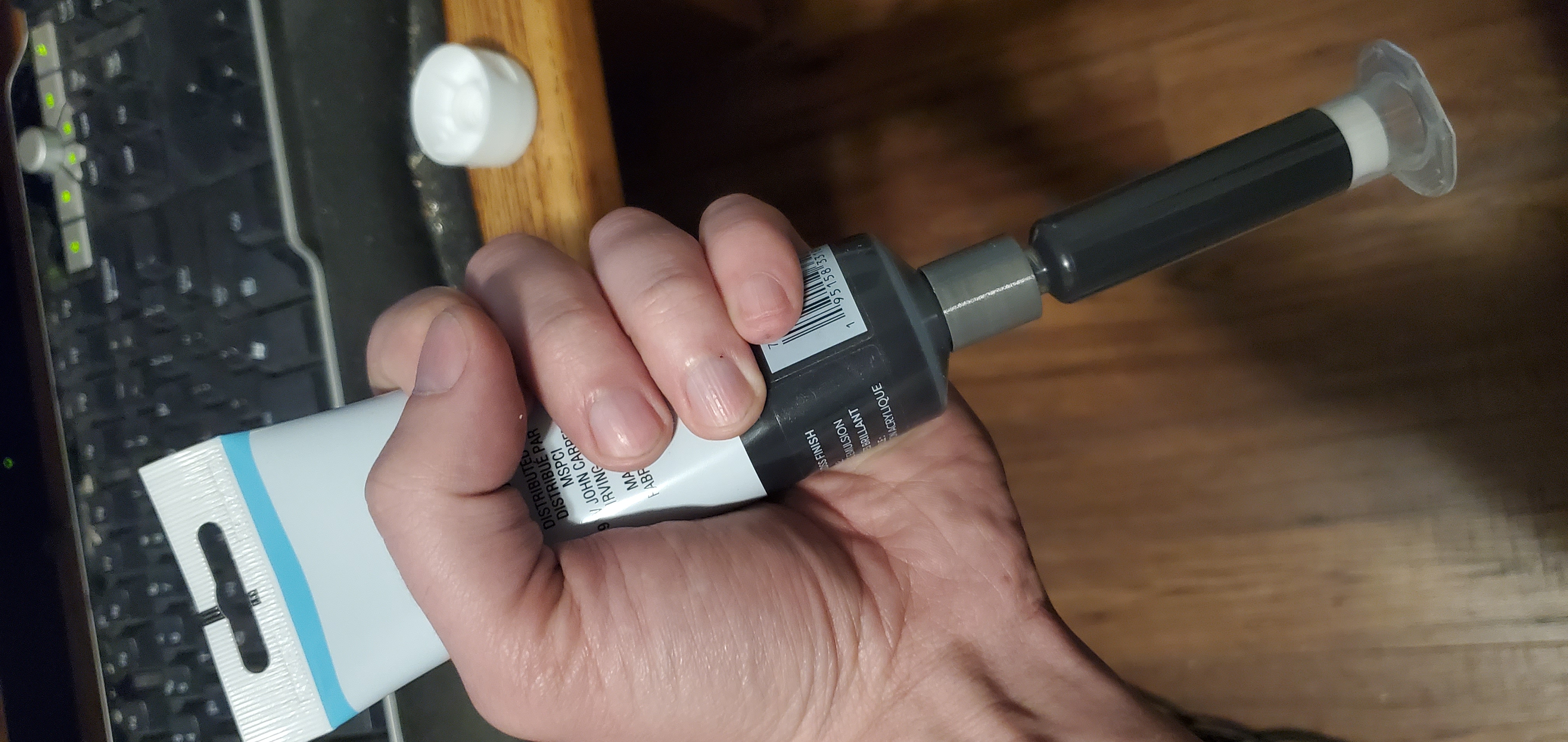 Soft tube to Luer lock syringe loading coupler