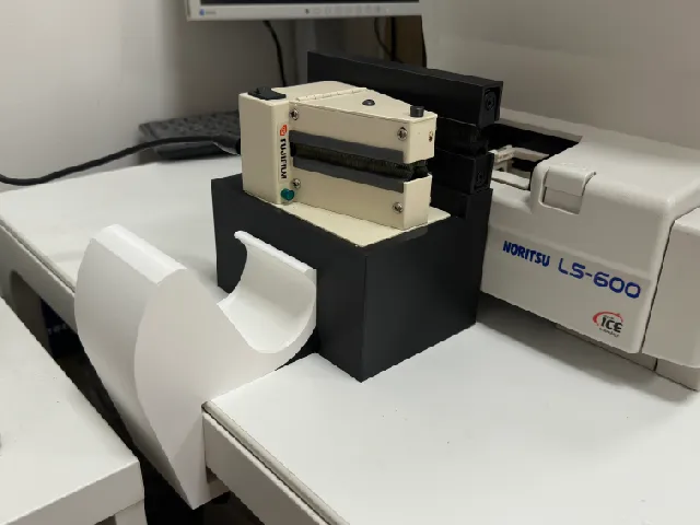 Film roll storage/catcher for scanning