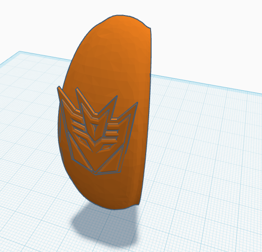 Transforming Pumpkin Spider Leg Slice with a Decepticon logo