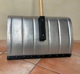 Adapter to adapt a stick to a snow shovel