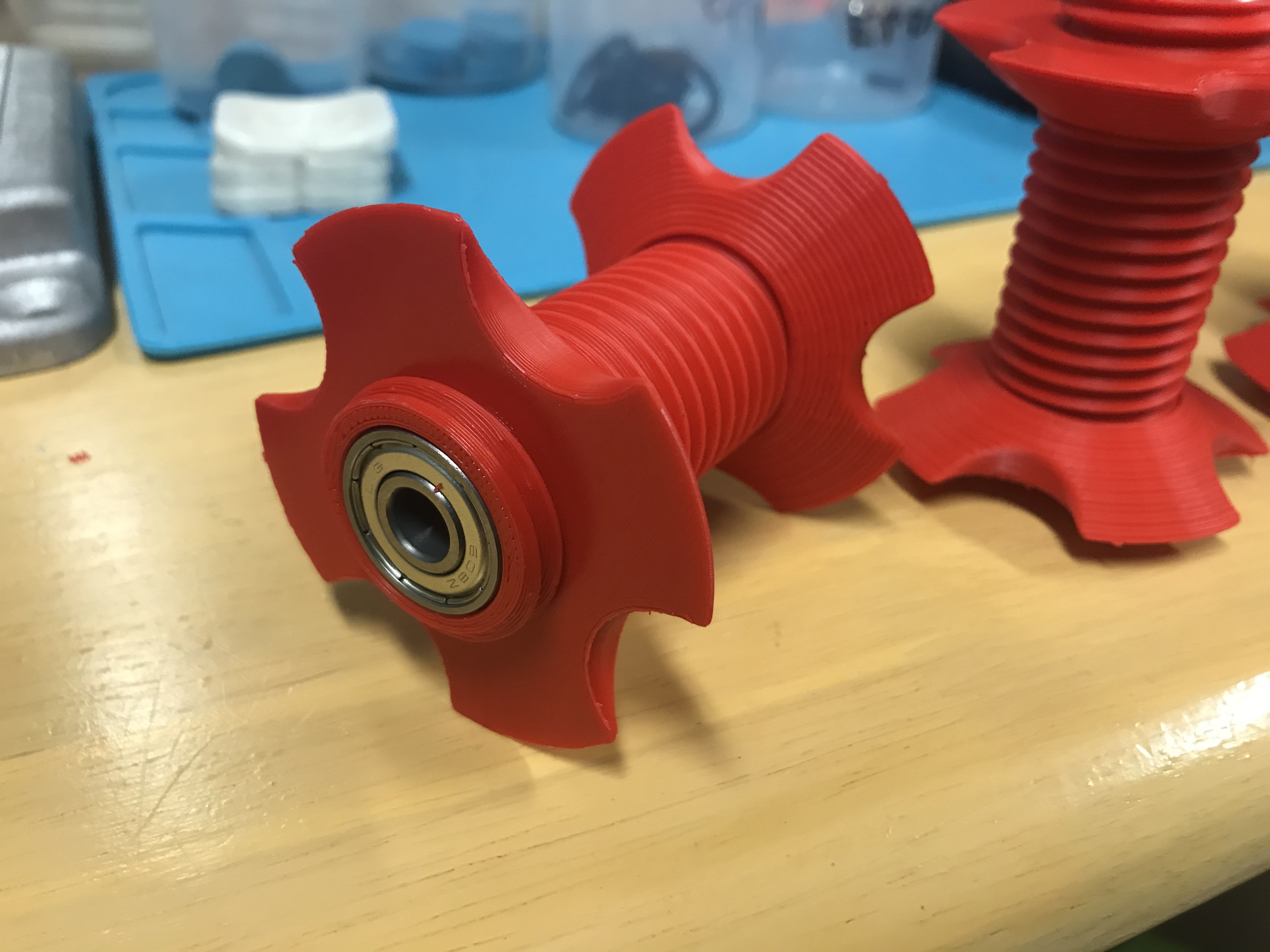 Central filament spool axis with bearings.