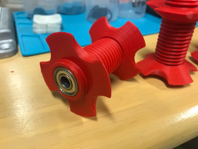 Central filament spool axis with bearings.