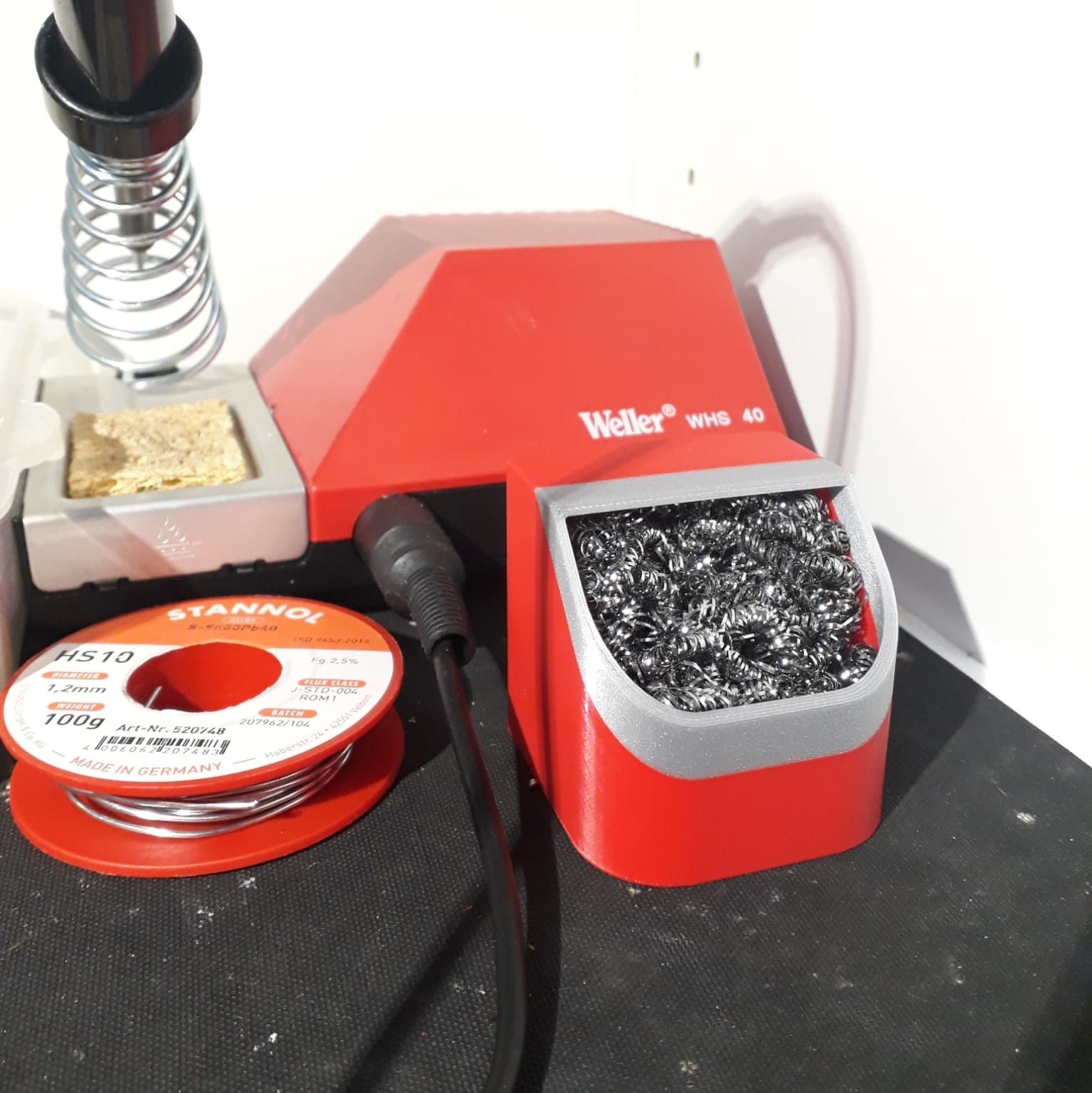Soldering iron tip cleaner