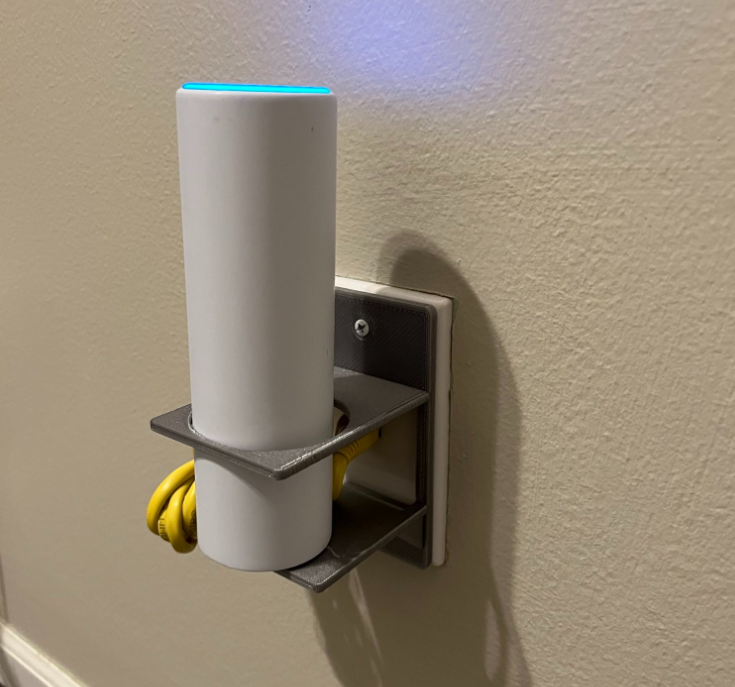 Wall mount for a Ubiquity UniFi6 Mesh that attaches to a network wall jack.