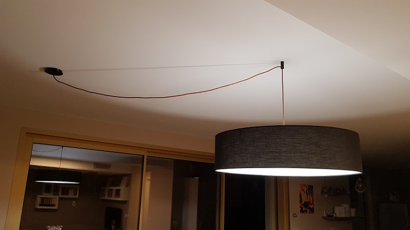 Electric wire cover and suspension for a dining room chandelier