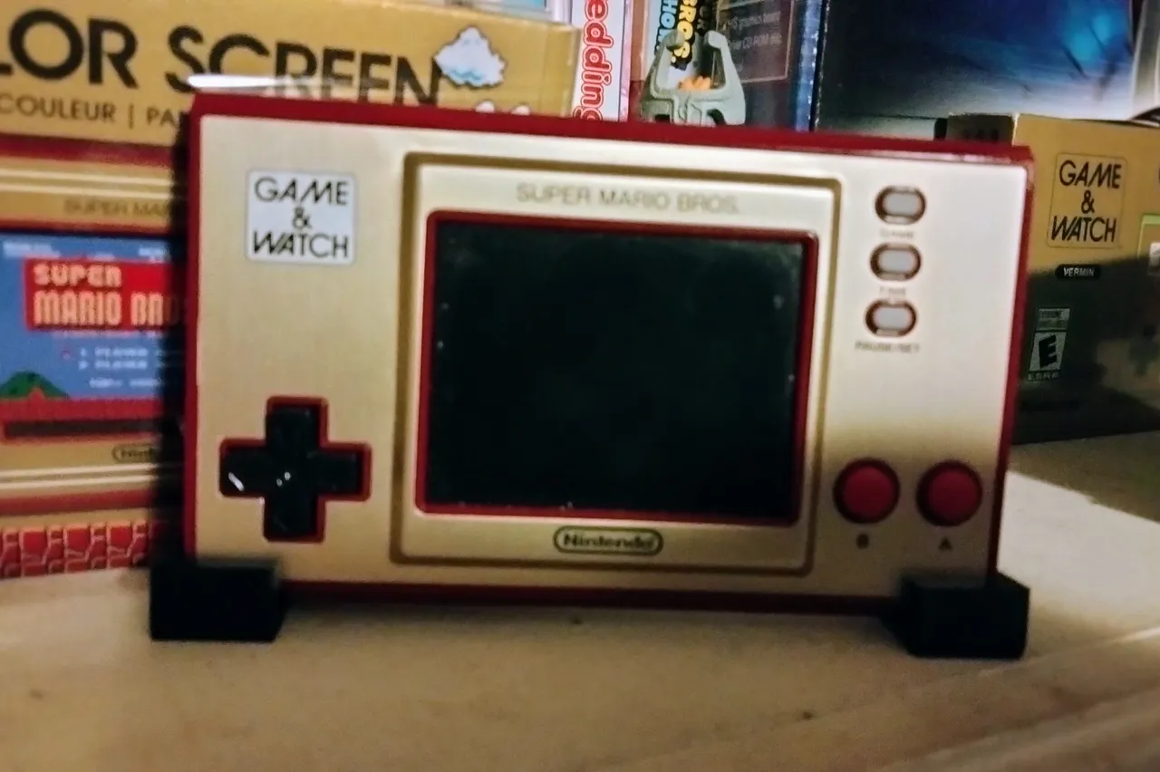 Super Mario Bros or The Legend of Zelda Game and Watch stand by