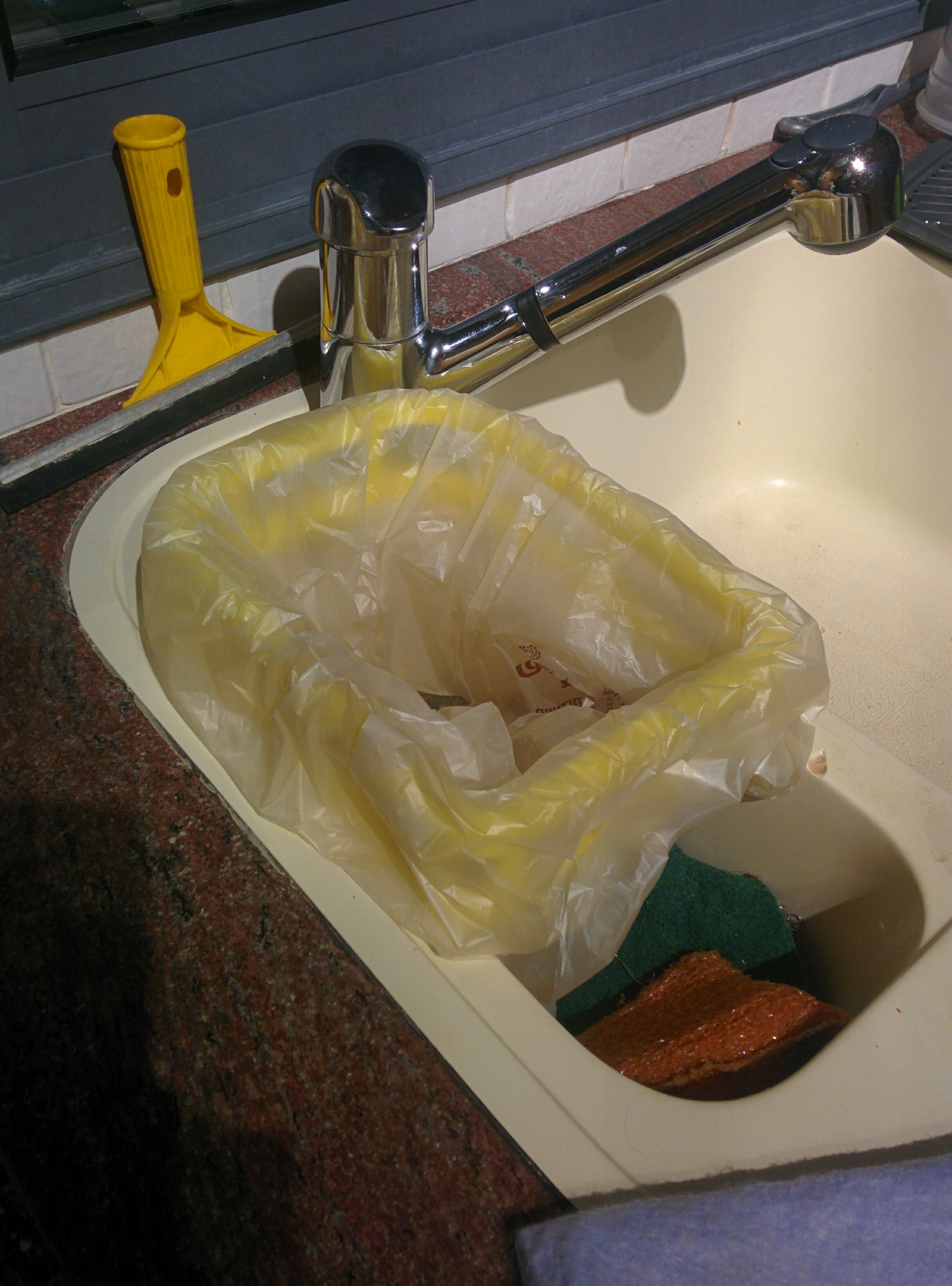Washbasin garbage bag holder