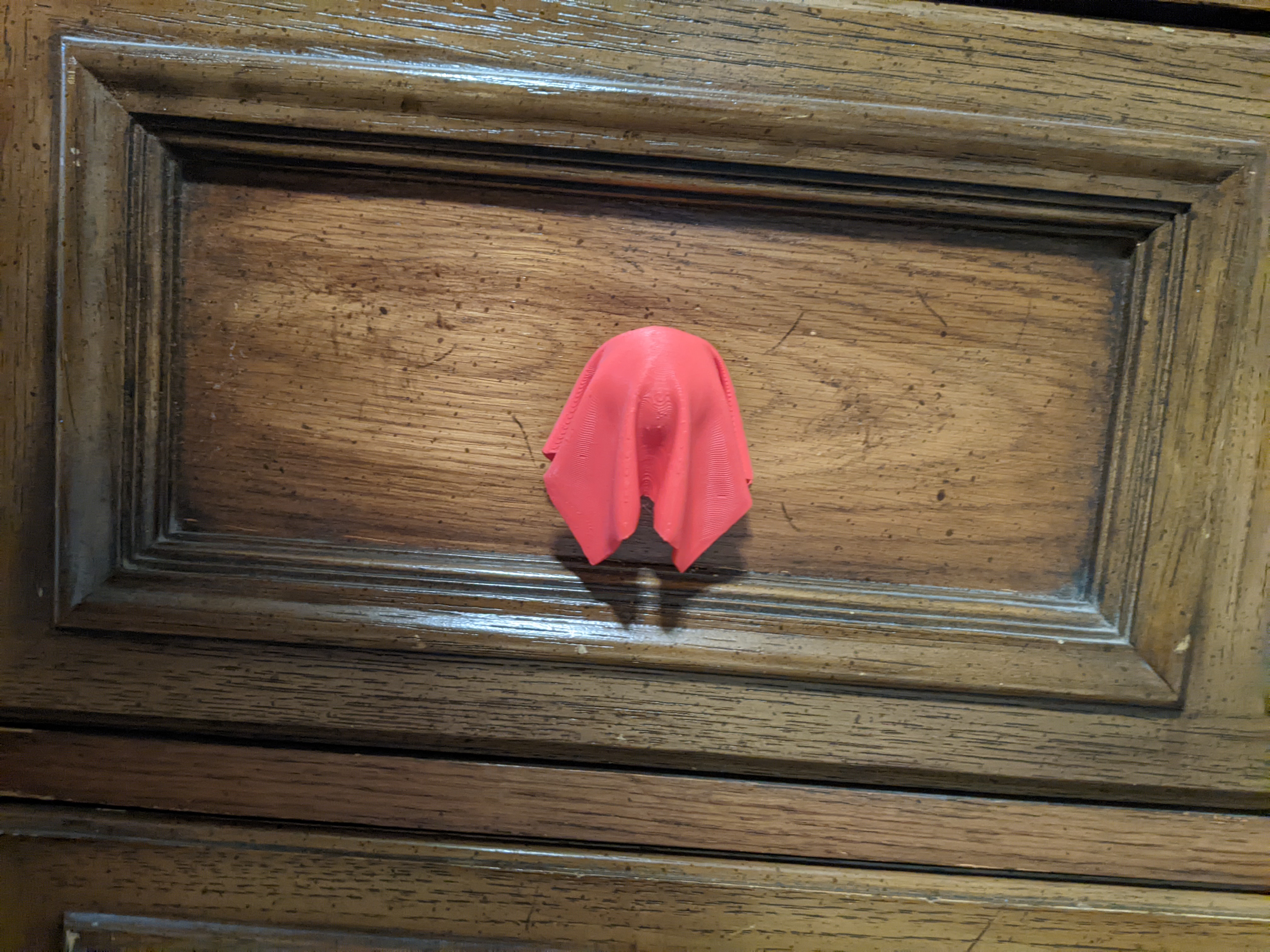 Cloth Draped Over Ball Cabinet Knob