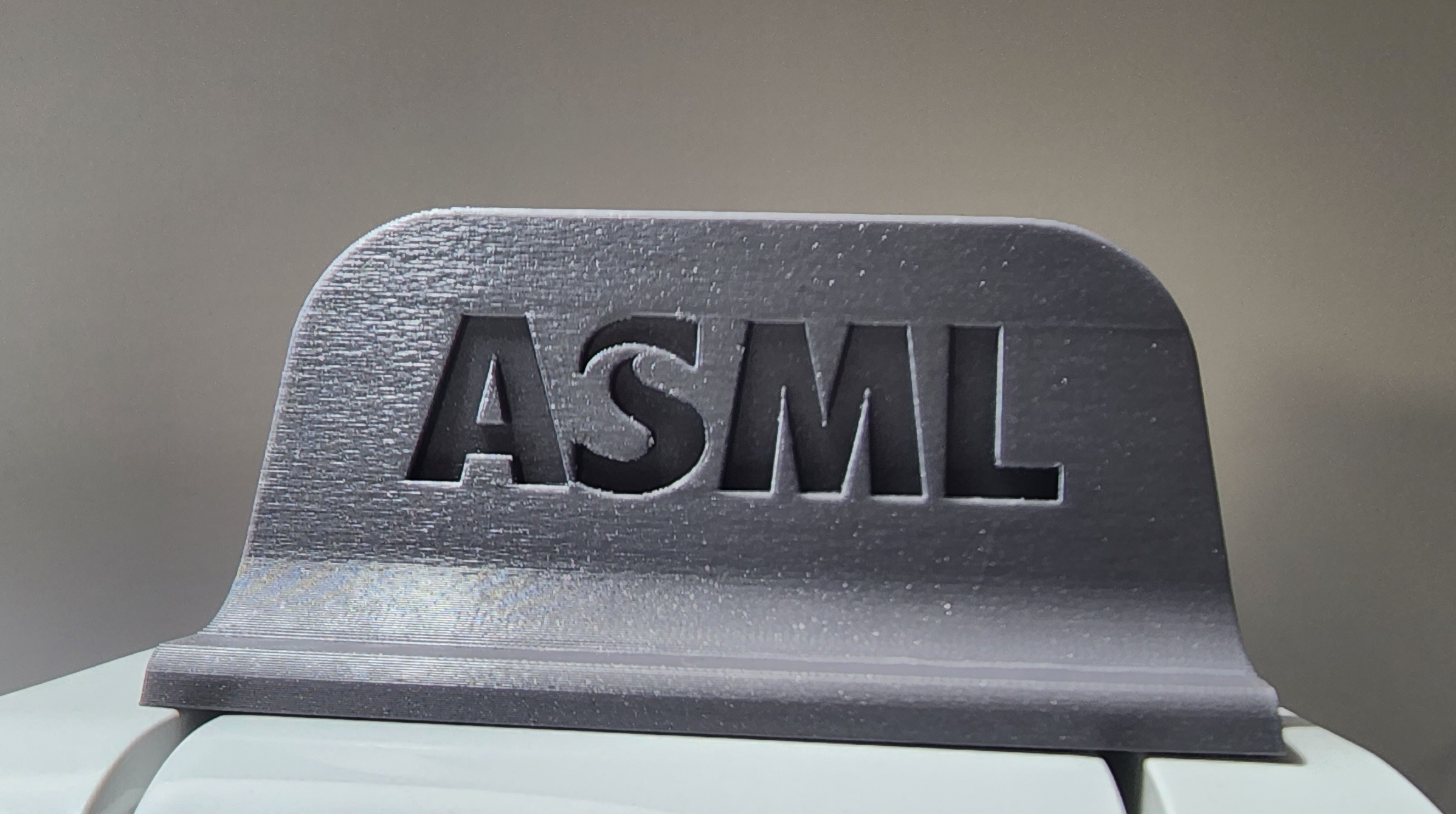 Laptop stand with ASML logo