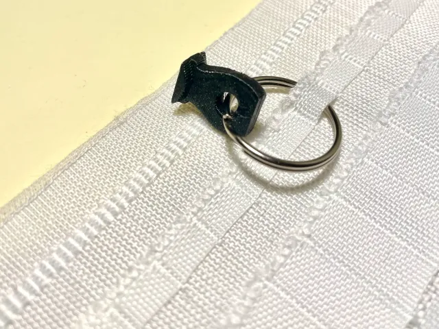Curtain hanger for rail system