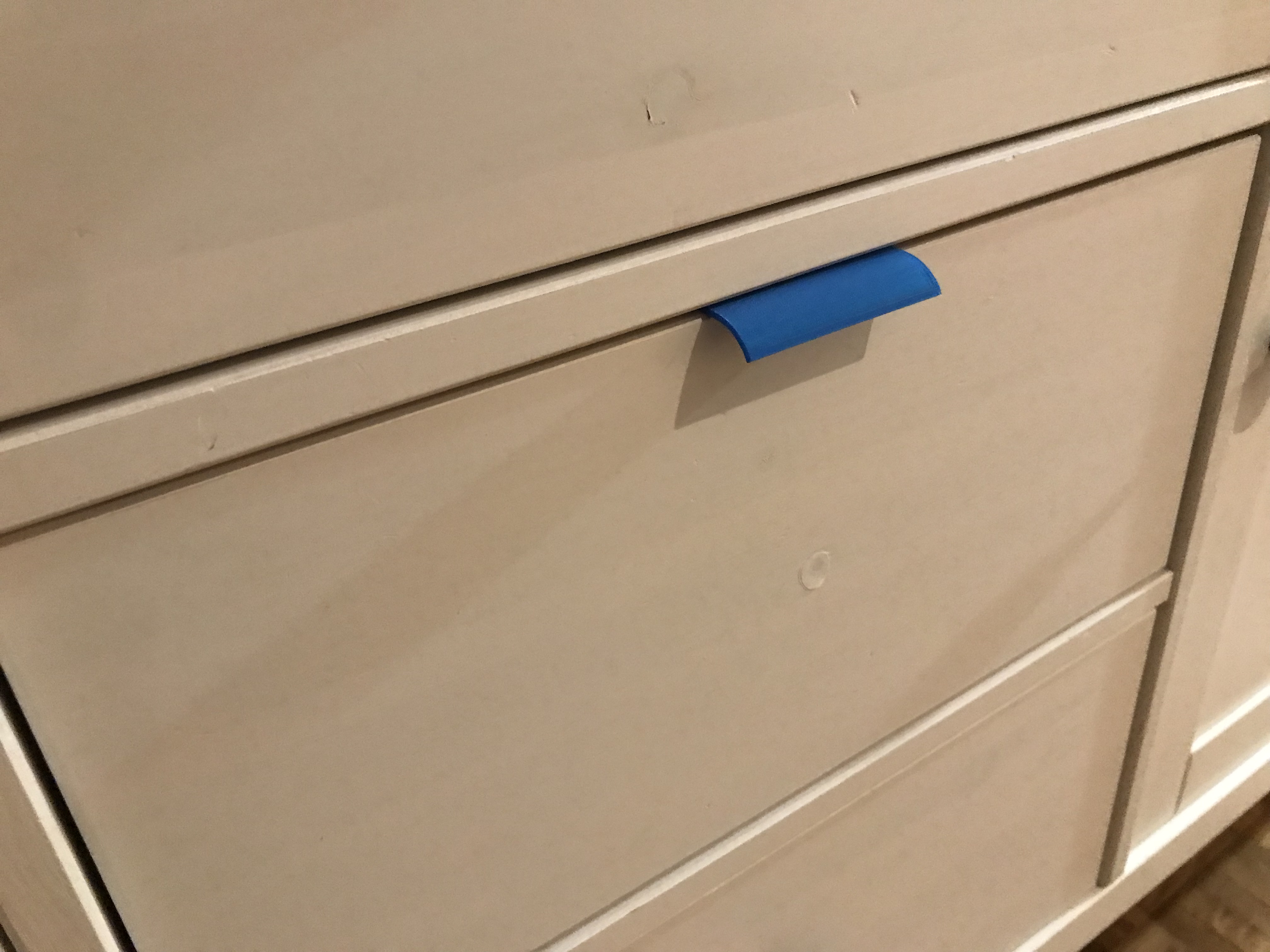 Relocated Drawer Knob or Handle