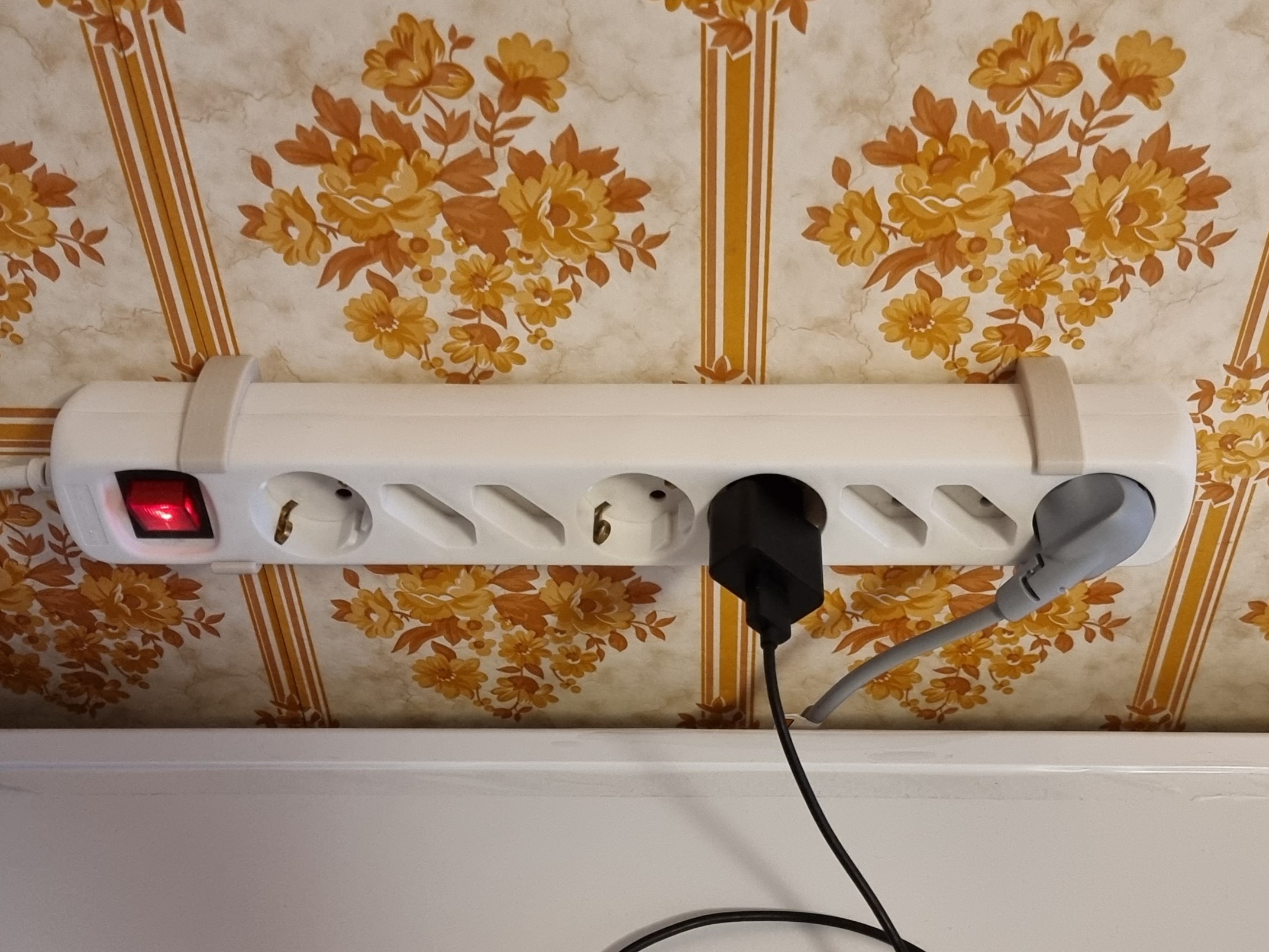 Outlet power strip wall mount by Micke Download free STL model