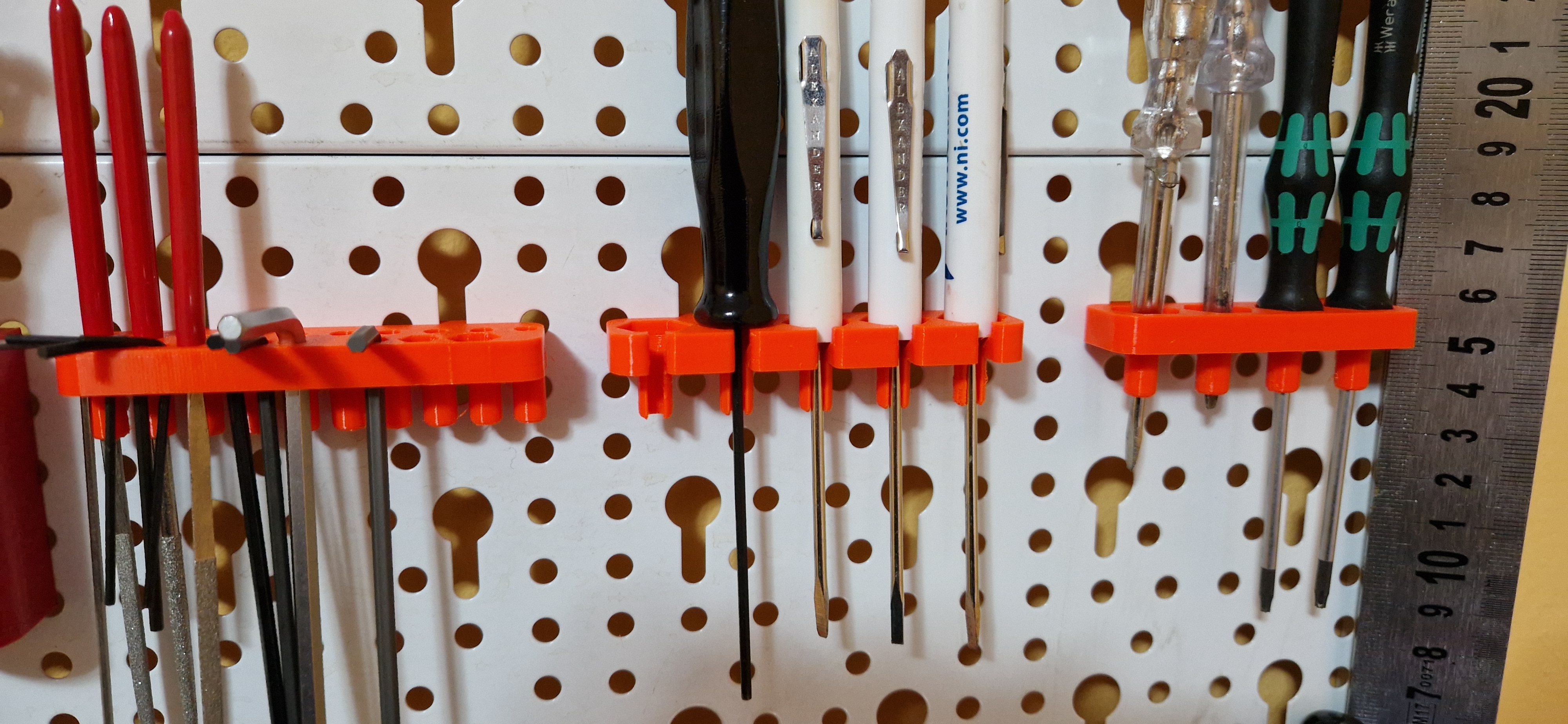 EuroTegometall pegboard with keyhole pattern by Alexandru Hauzman