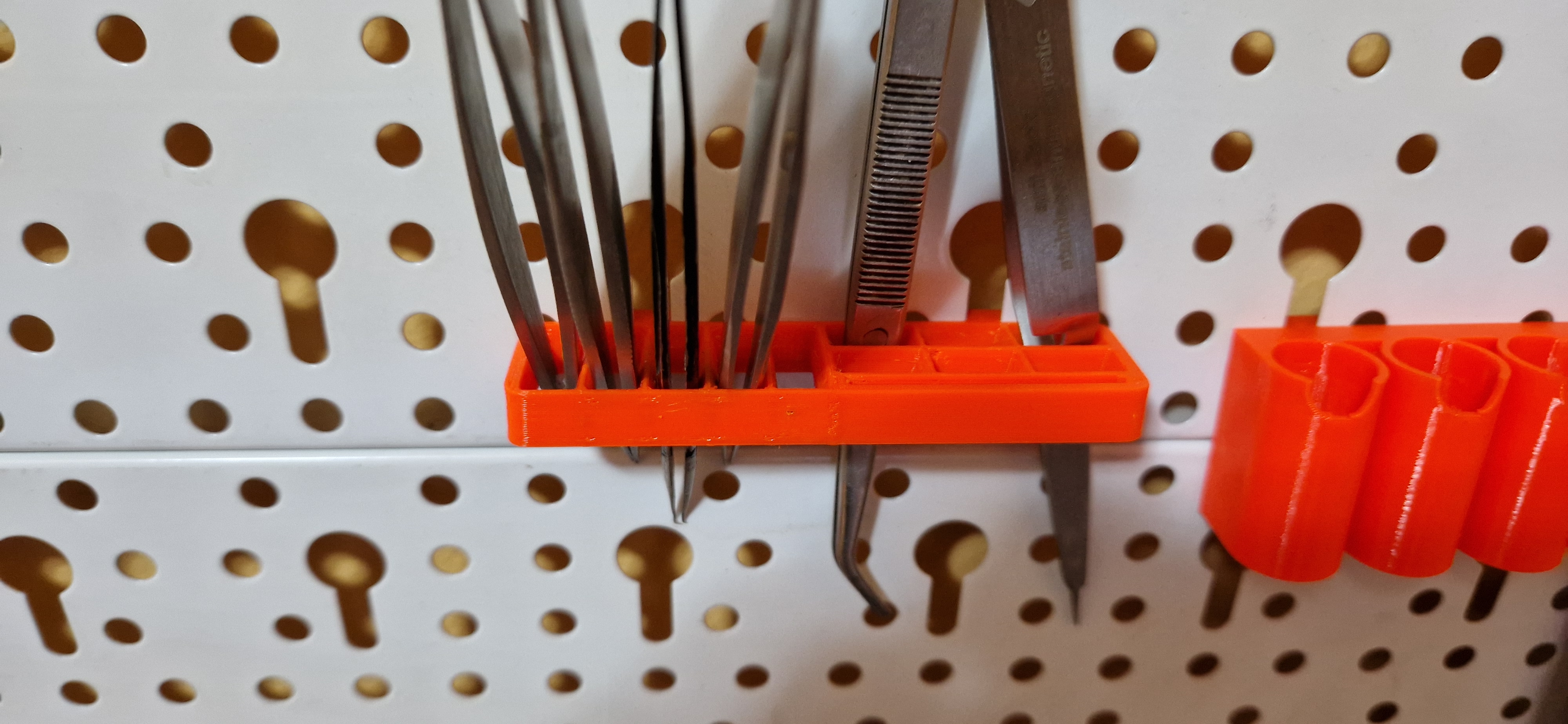 EuroTegometall pegboard with keyhole pattern by Alexandru Hauzman