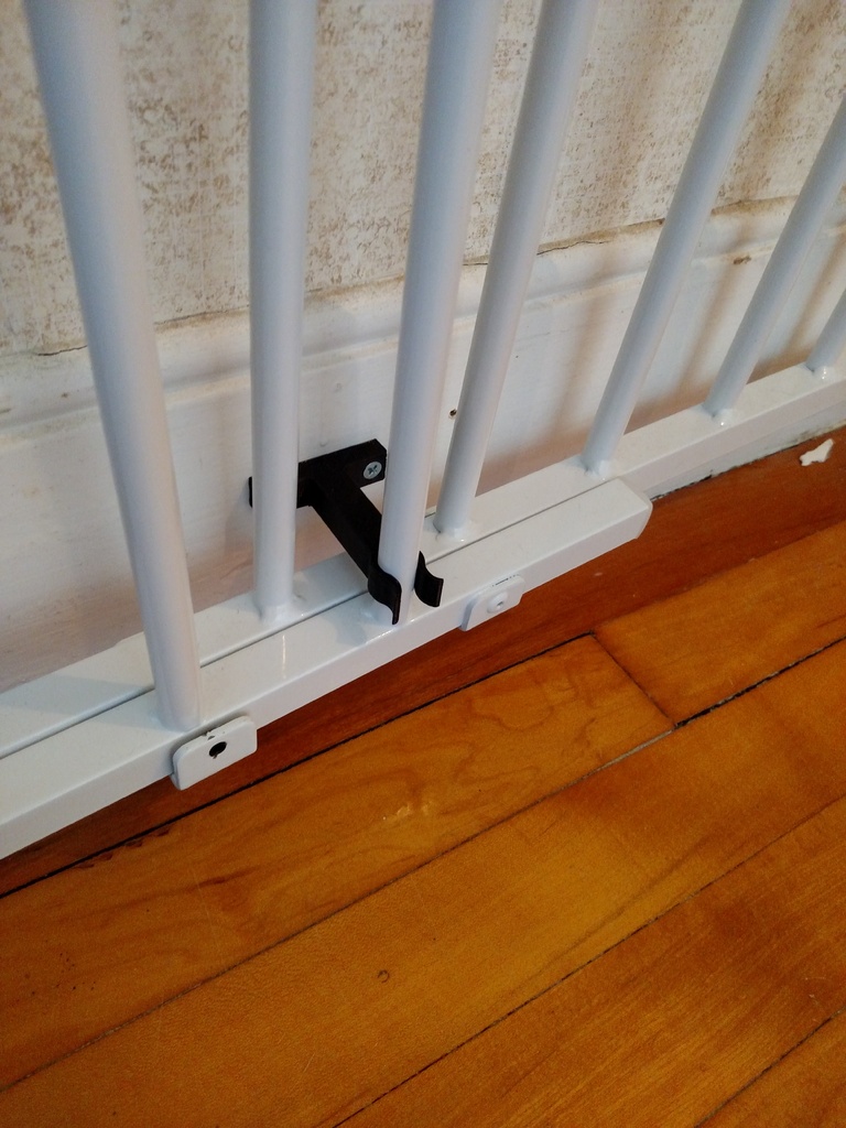 Clip for swinging baby gate