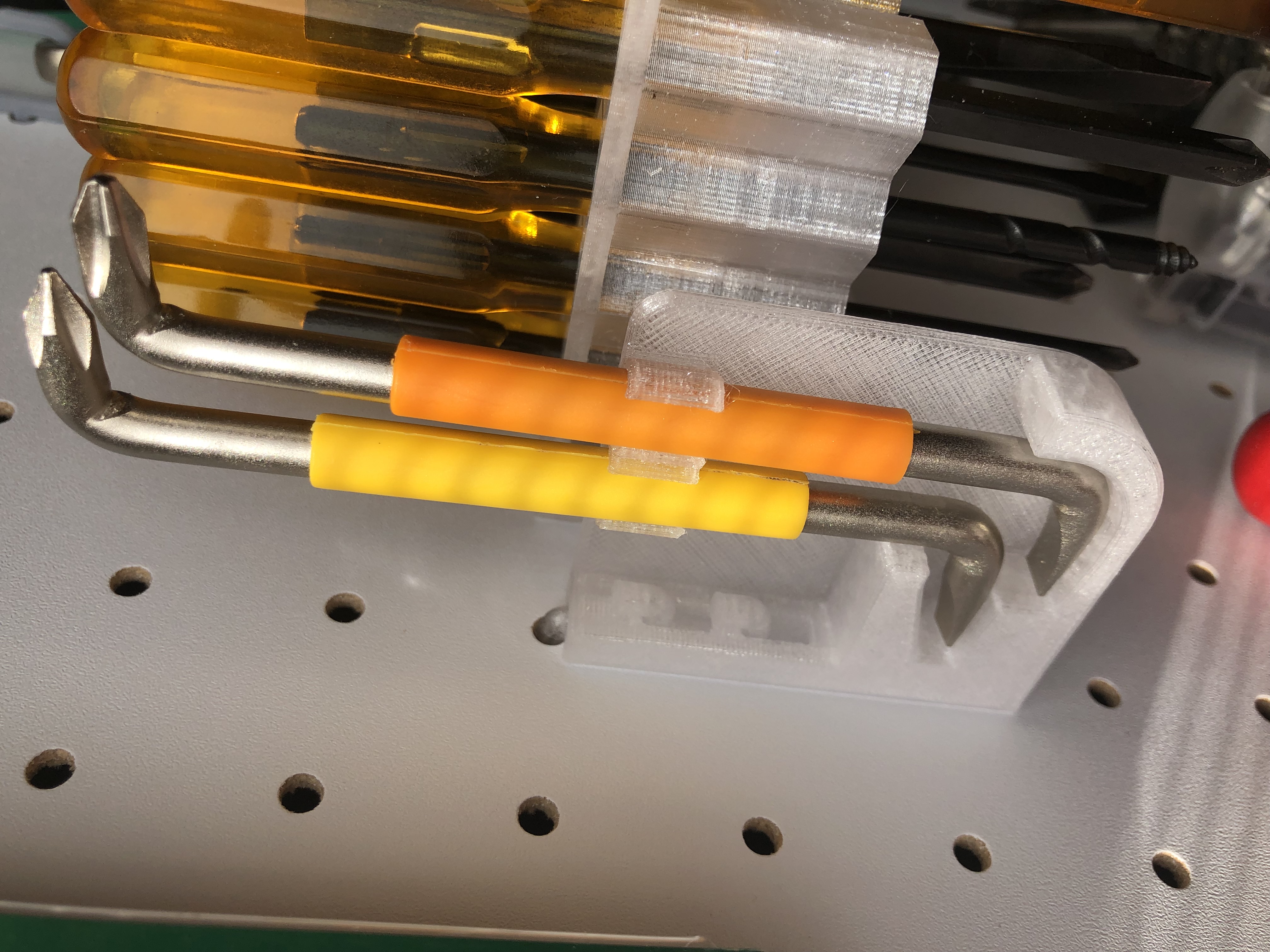 Offset screwdriver holder for pegboard