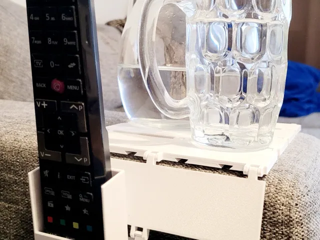 Modular armrest table with remote control holder