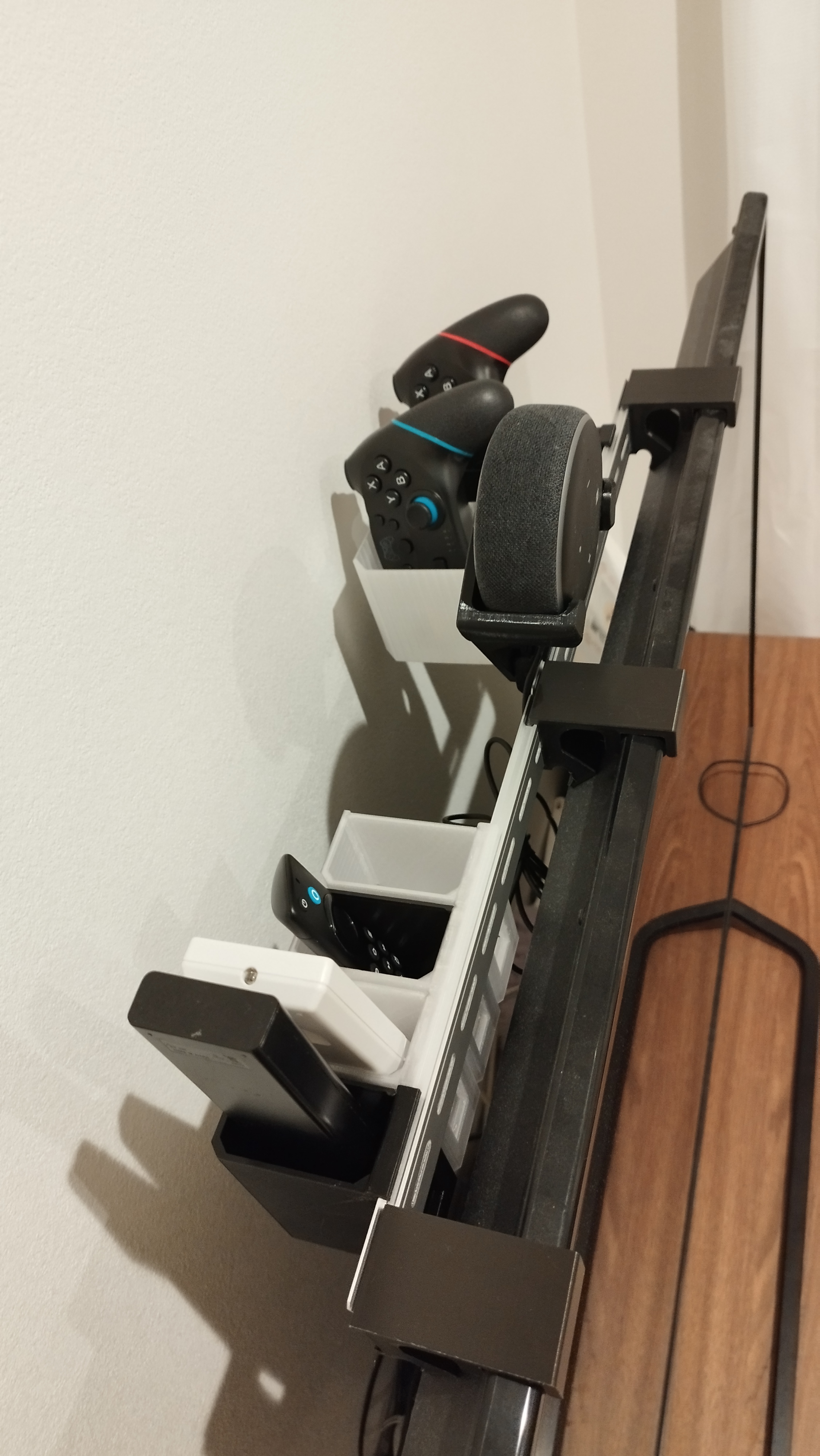 TV top remote holder using DIN Rail