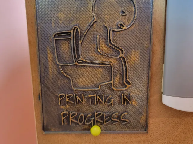 Printing in progress bathroom sign