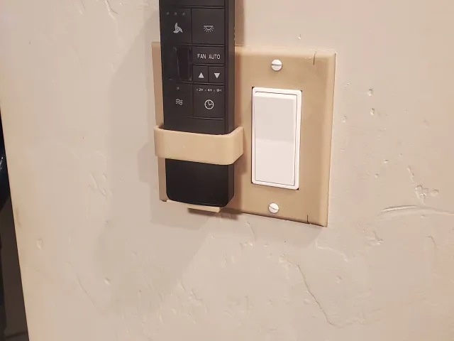 Fan remote light switch holder