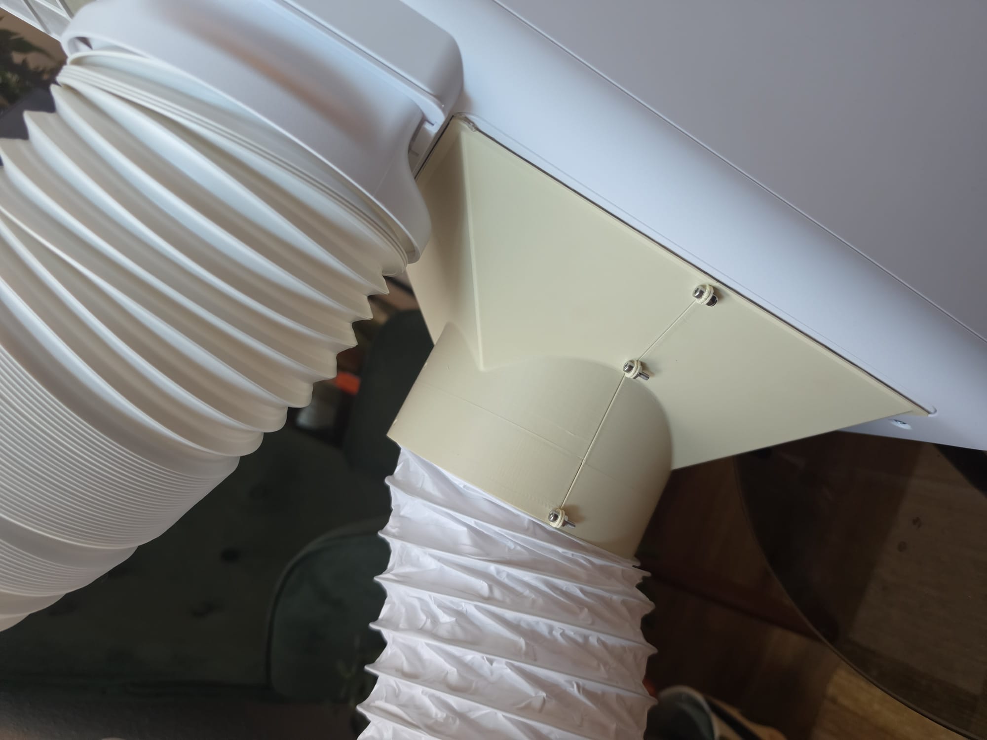 Printed 150 mm intake funnel connecting an intake hose to a window cover