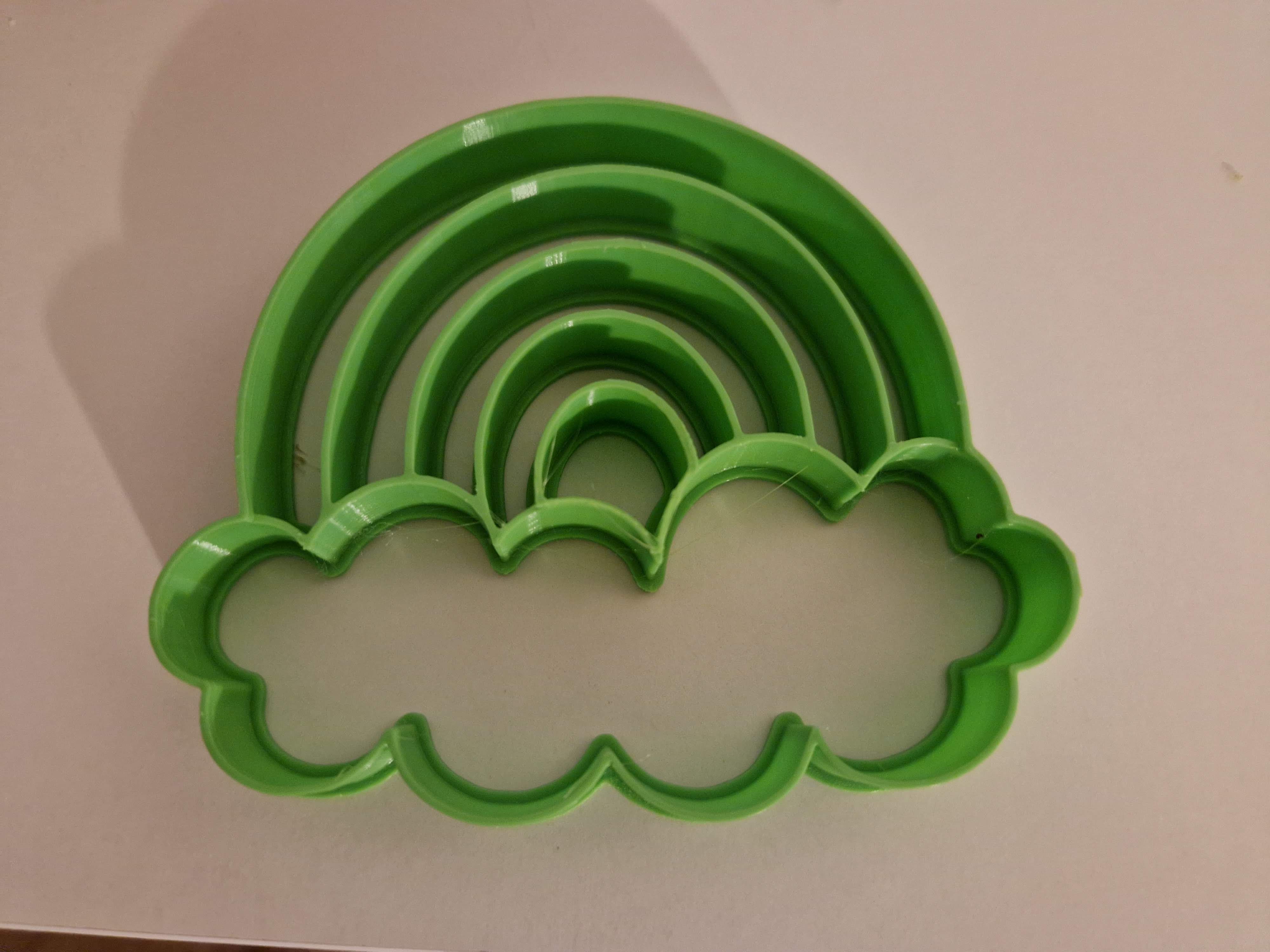 Cookie cutter in the shape of a rainbow