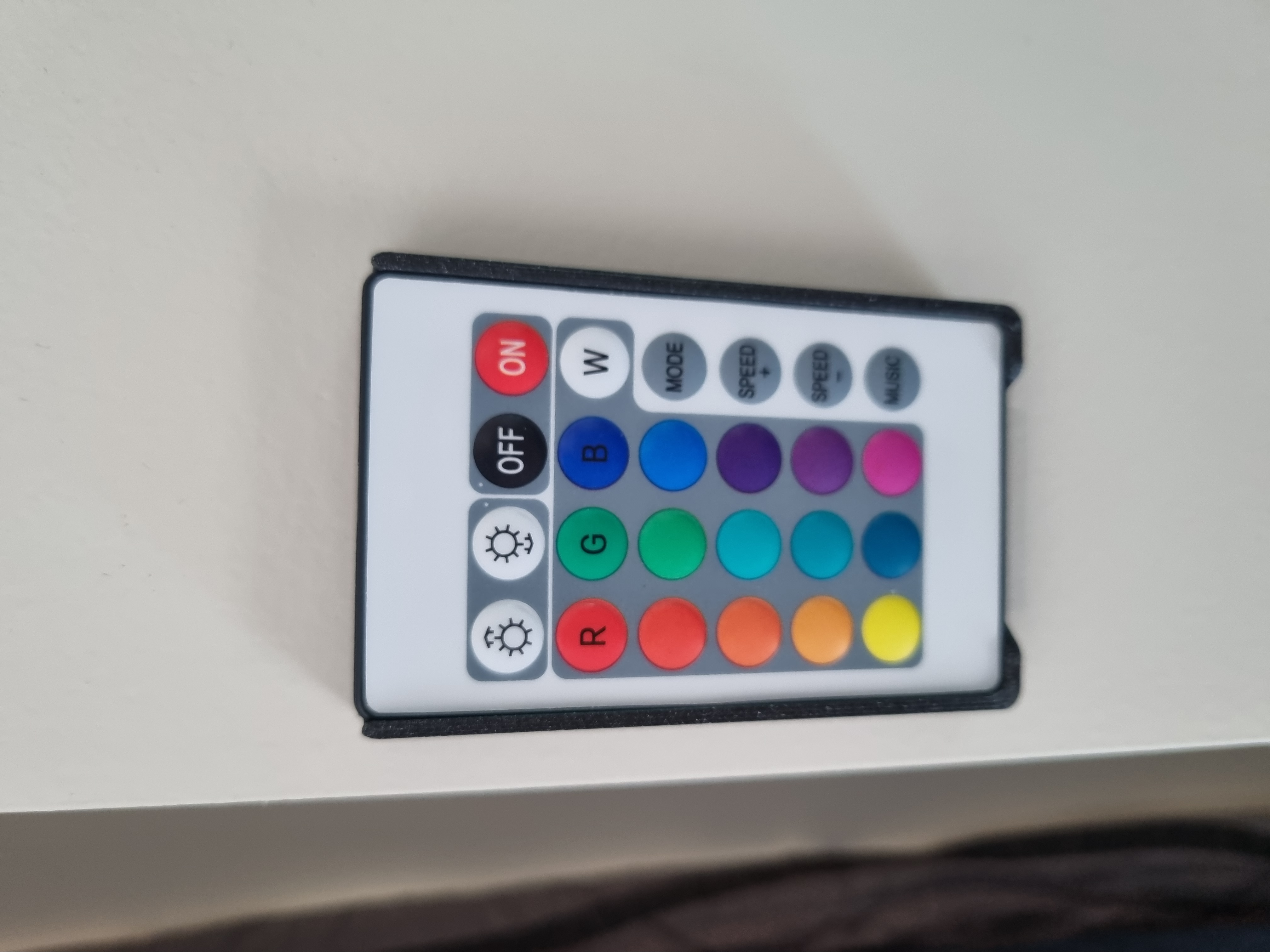 Slim LED remote mount with finger release