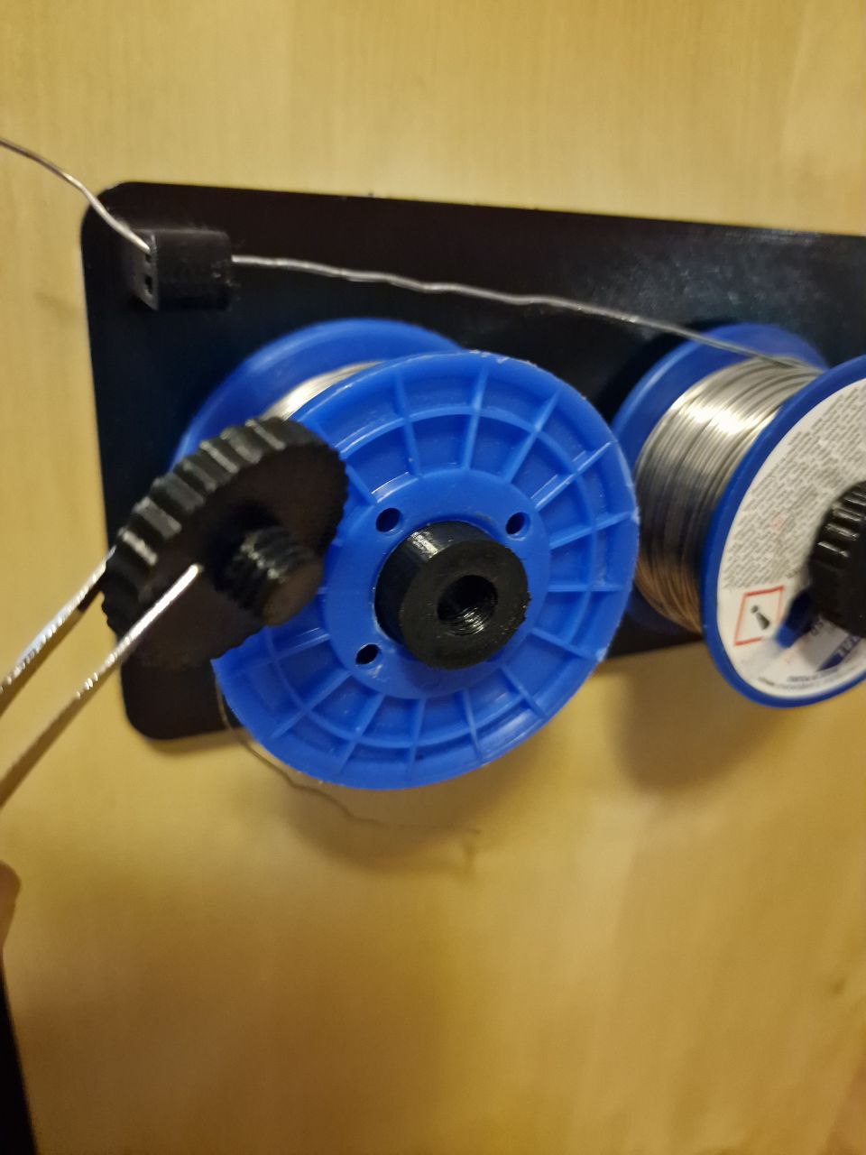 Wall mounted solder spool holder by Firecactus Download free STL