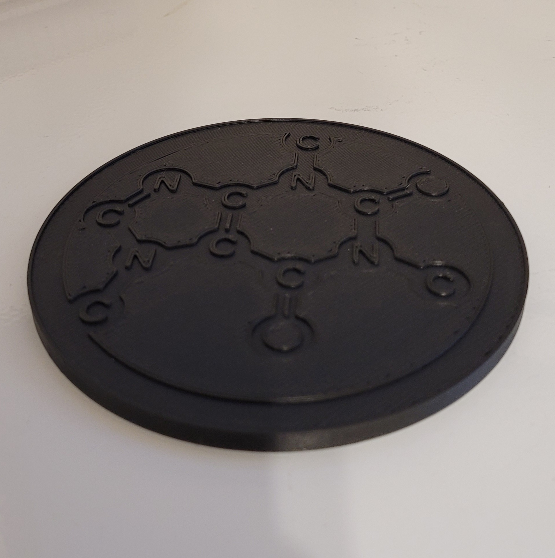 Solid caffeine molecule coaster