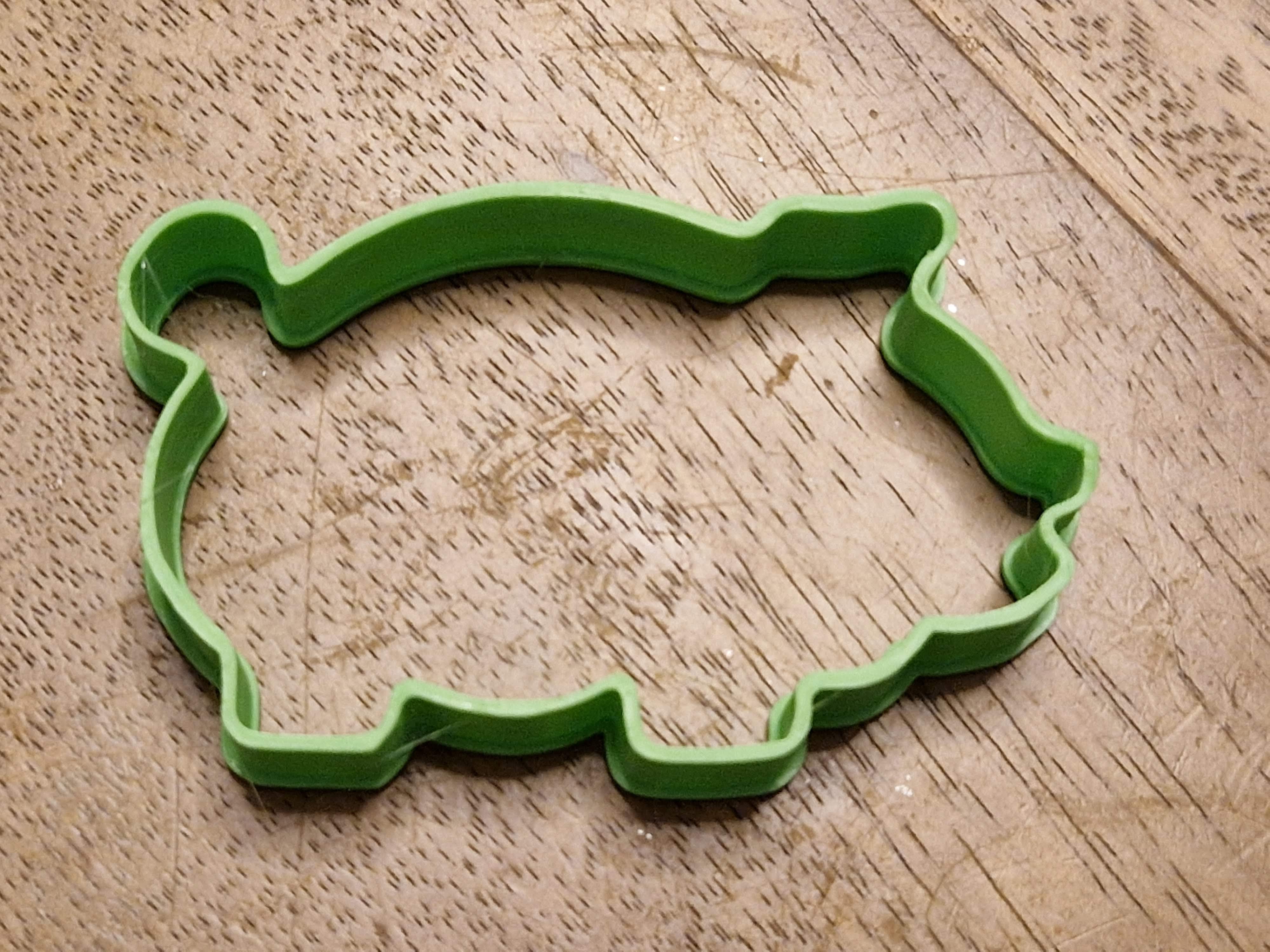 Cookie cutter in the shape of a pig
