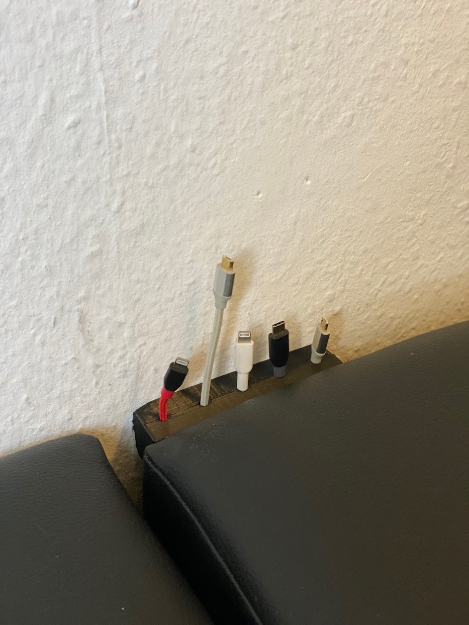 Couch cable holder