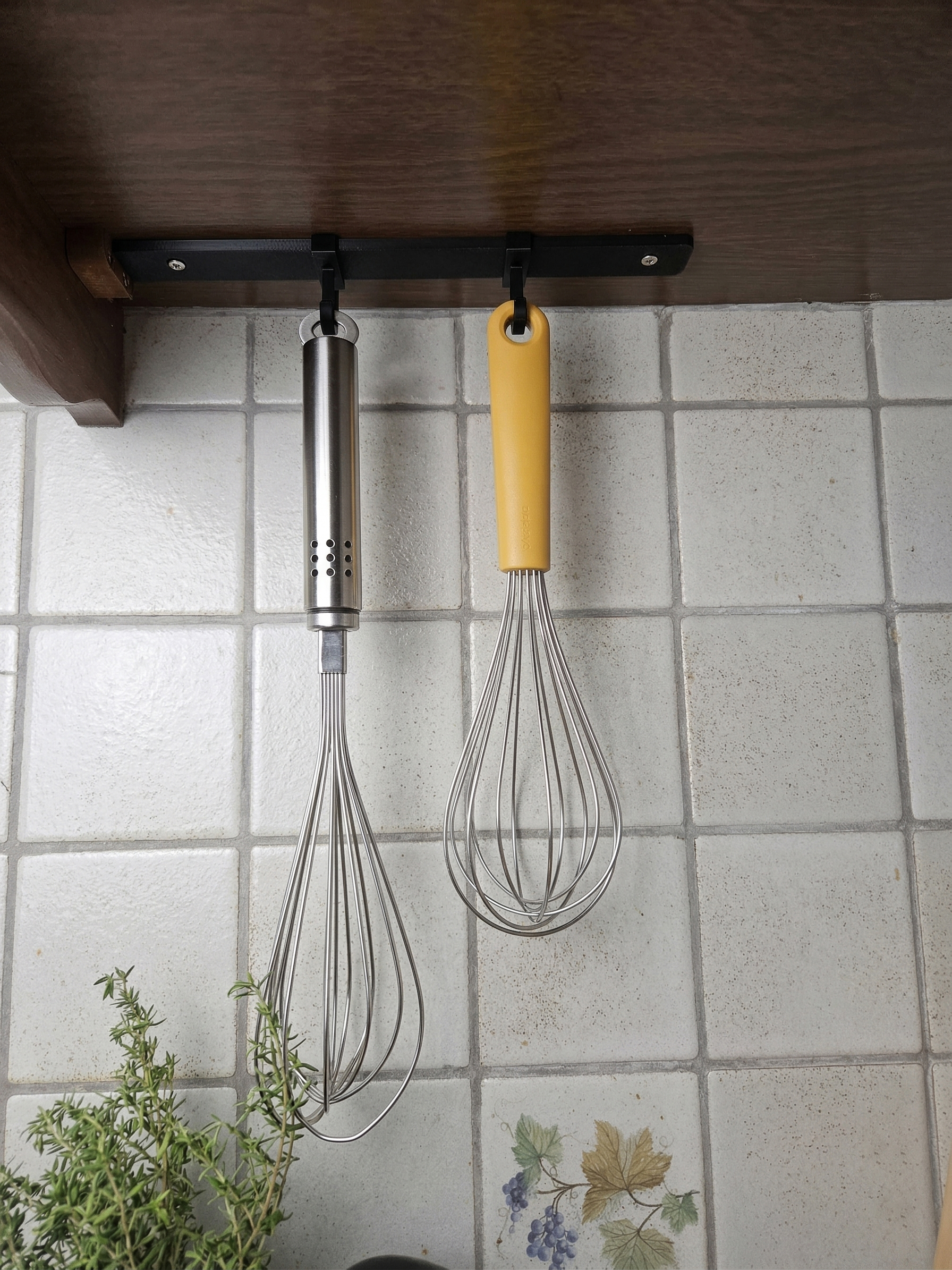 Rail system with under the cabinet sliding hooks
