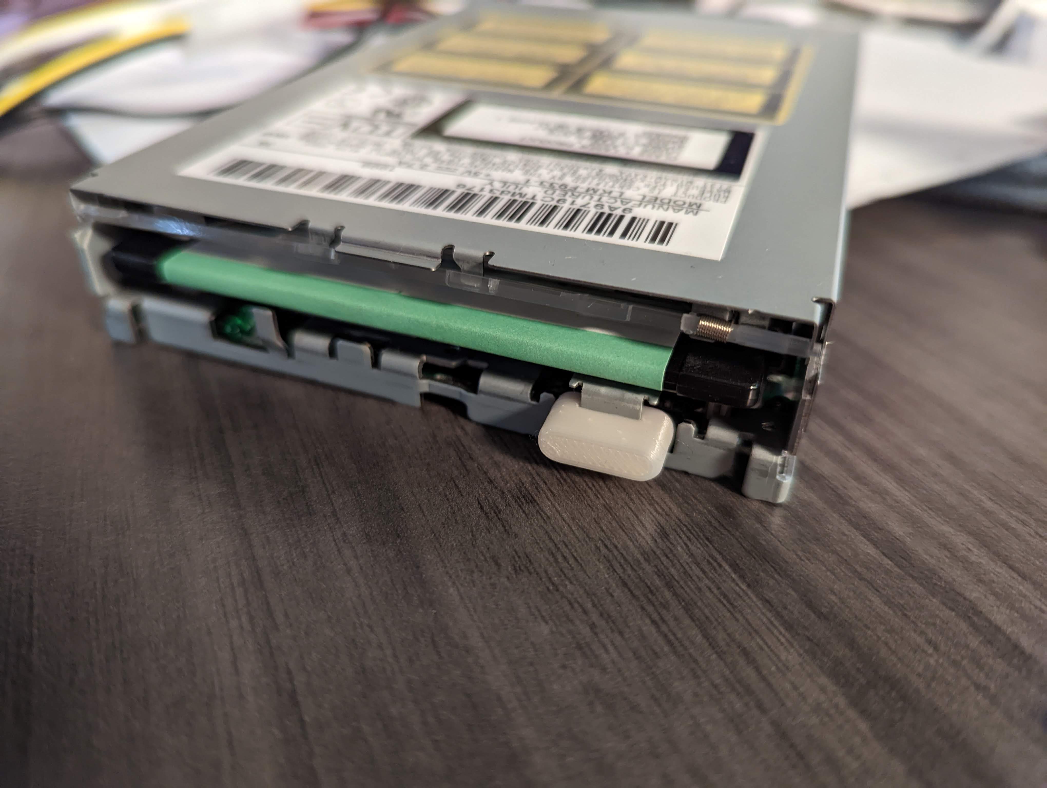 LS 120 / SuperDisk manual eject button (Matsushita / Imation) by