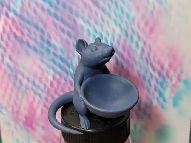 Rat holding a bowl