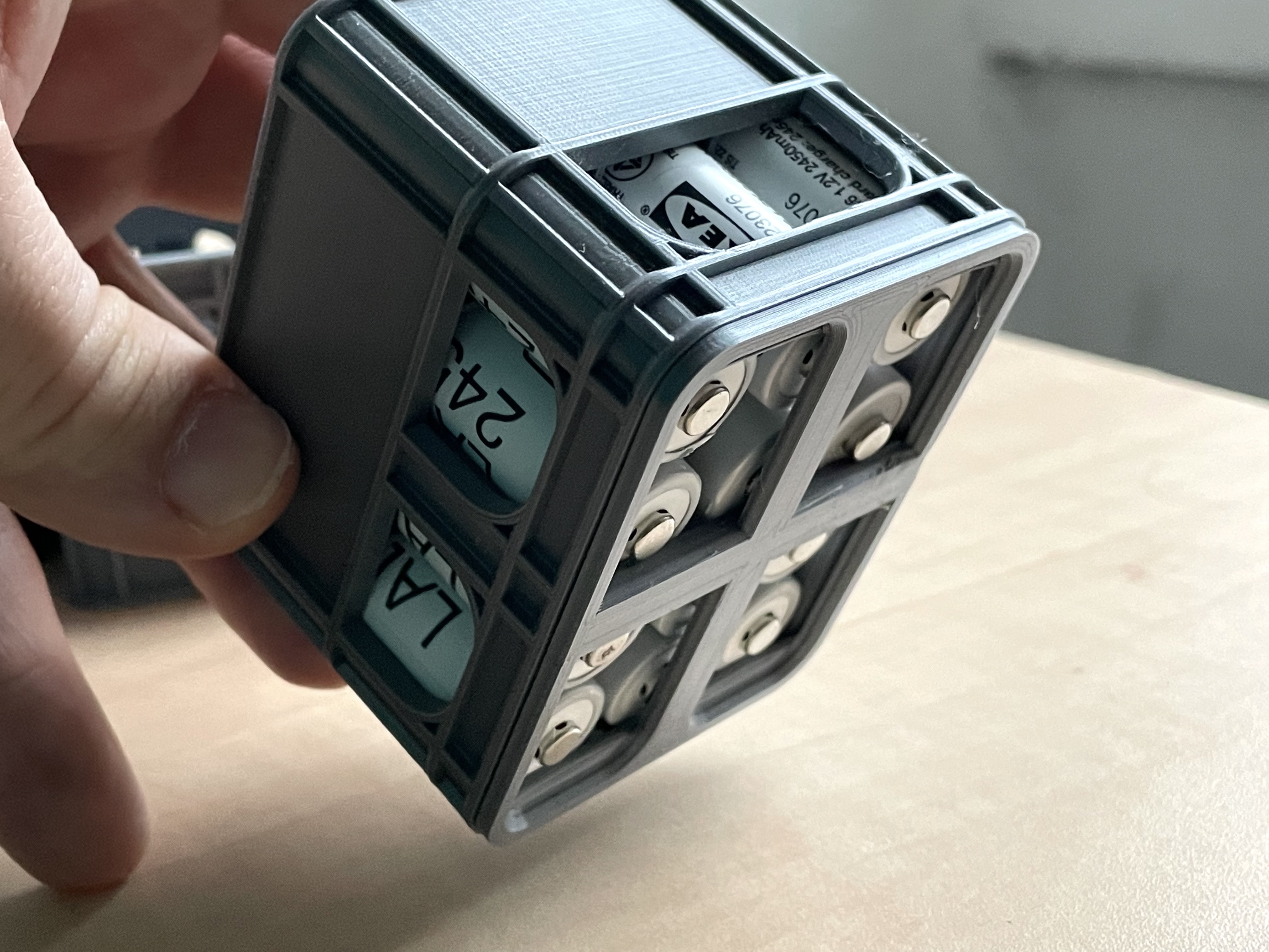 Safety lid for stackable beer storage box for AA batteries