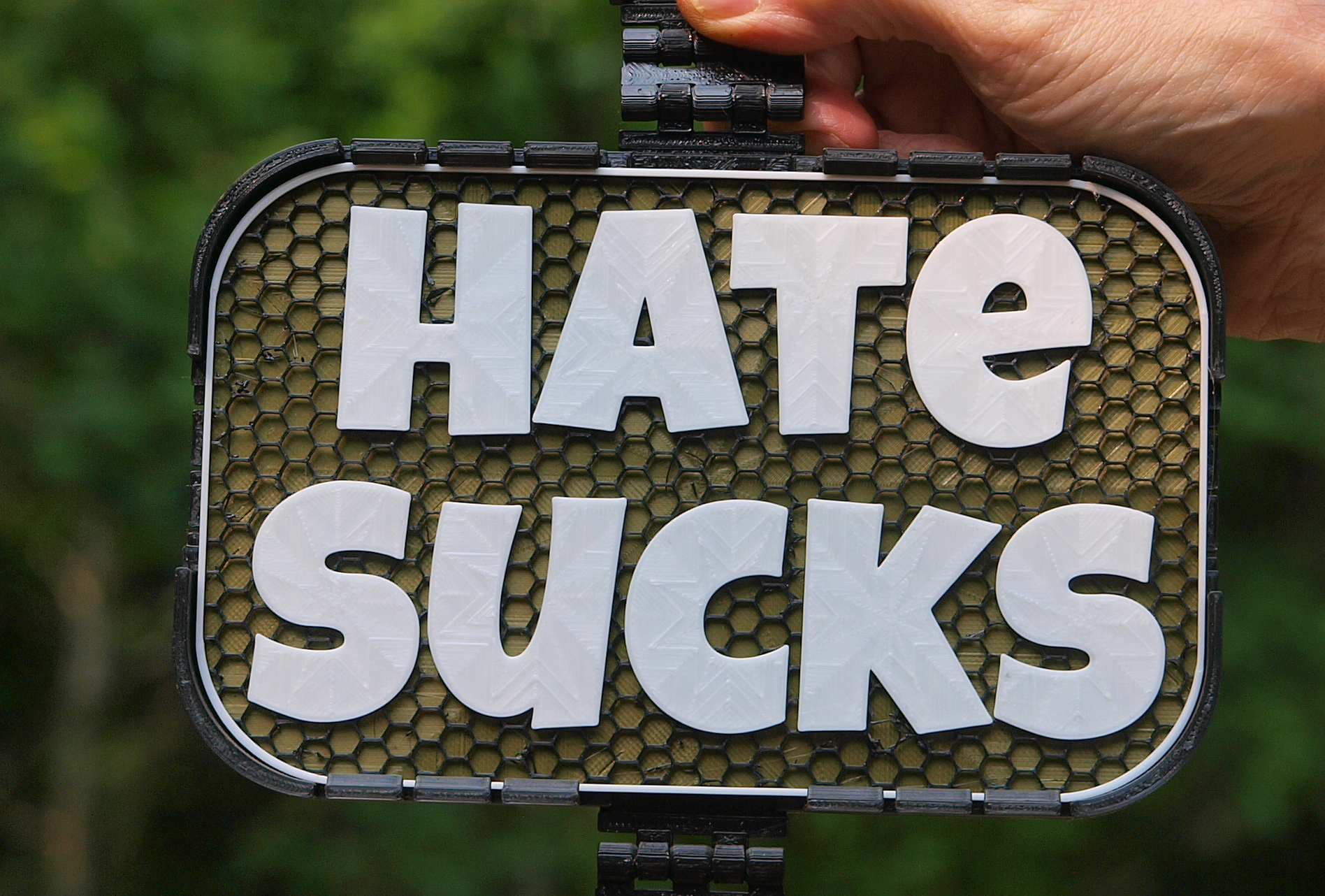 Hate Sucks sign