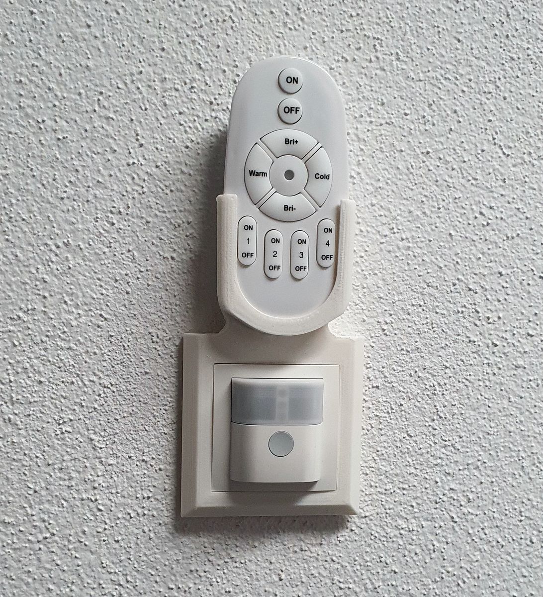LED panel remote controll holder embedded into wall switch frame