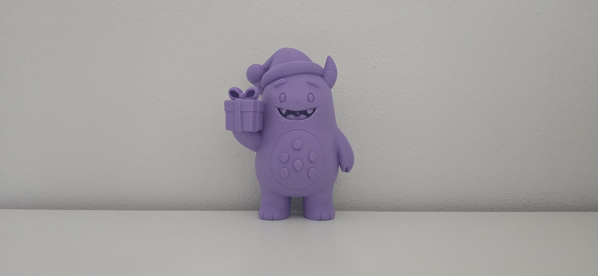 Cute Monster with Santa Hat and Gift Christmas Figurine