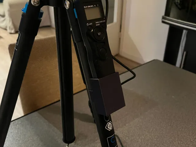 Intervalometer holder for tripod