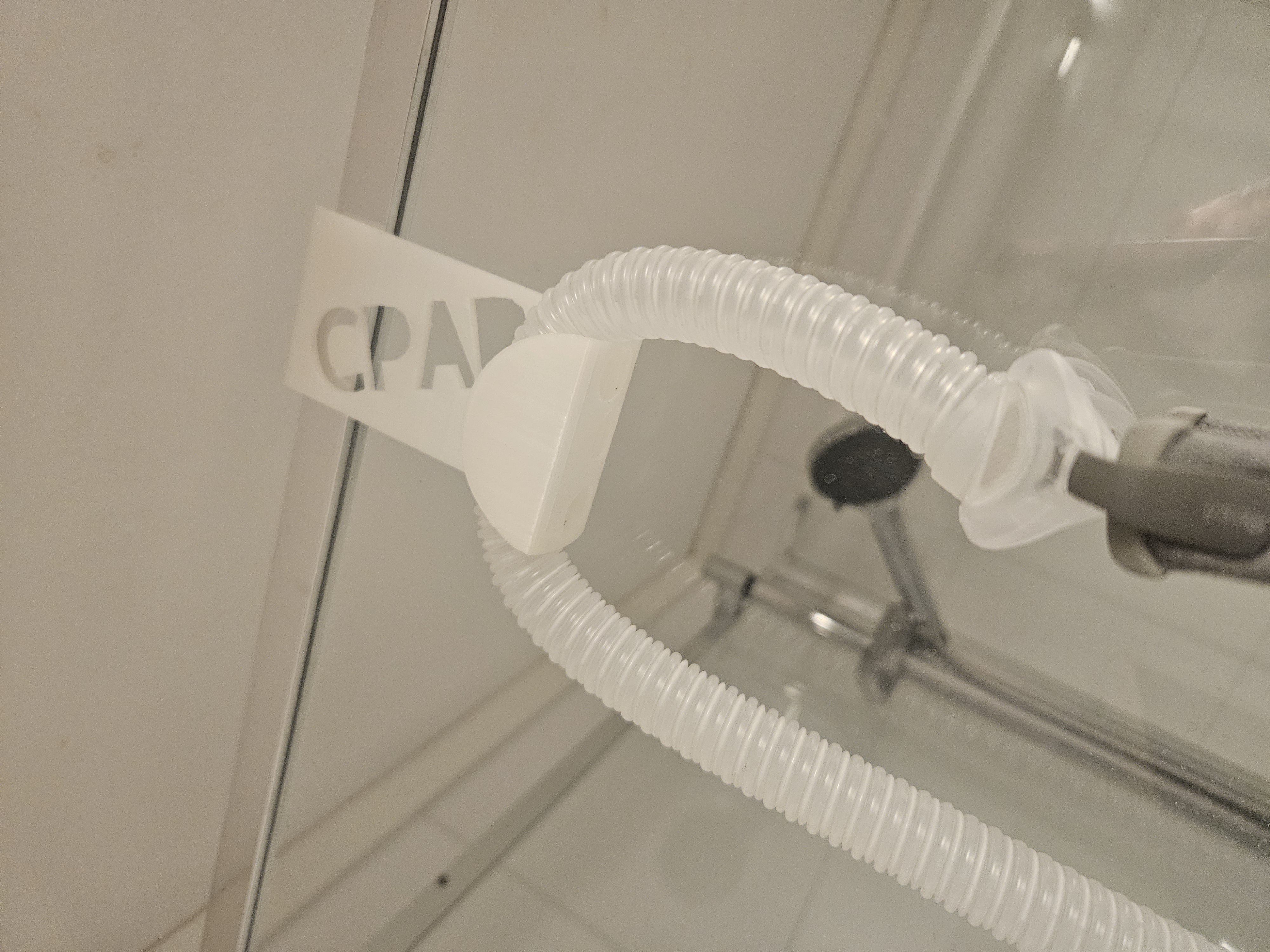 CPAP hose shower holder