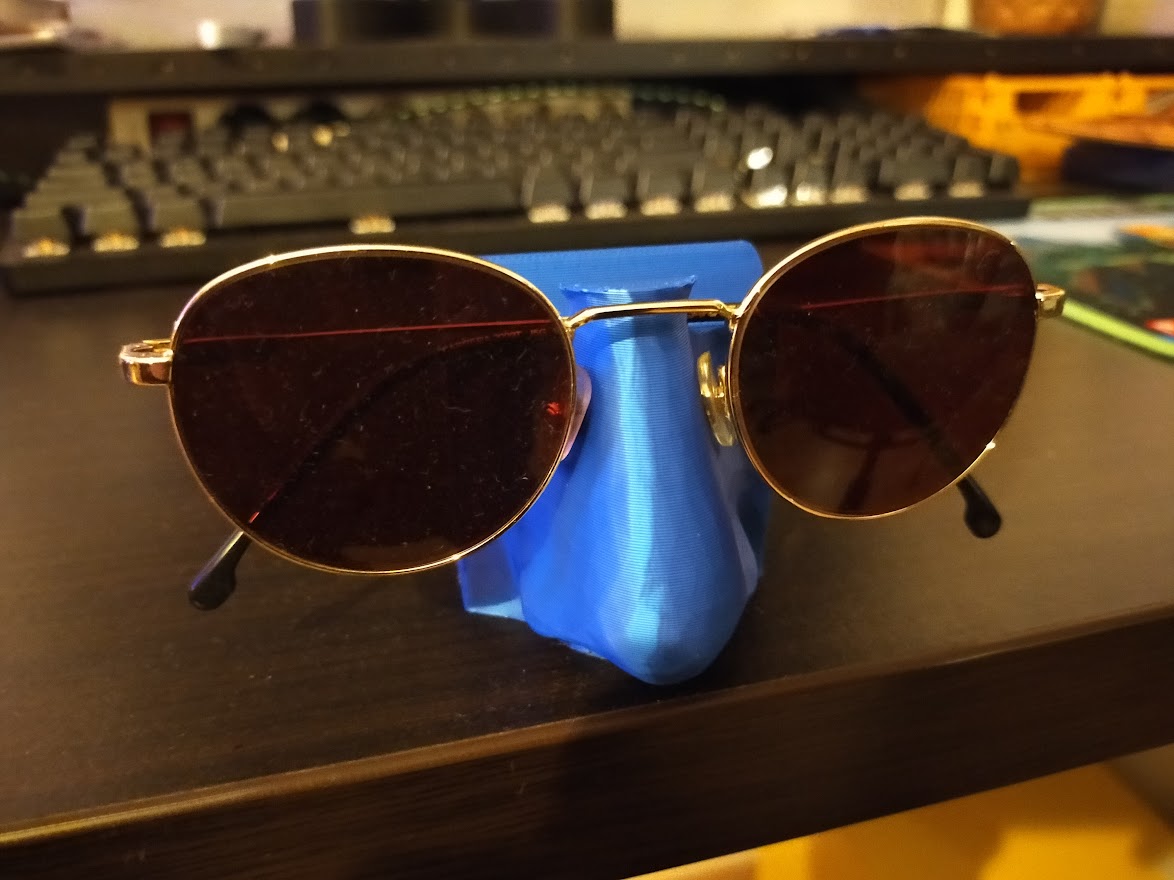Nose eyeglass holder